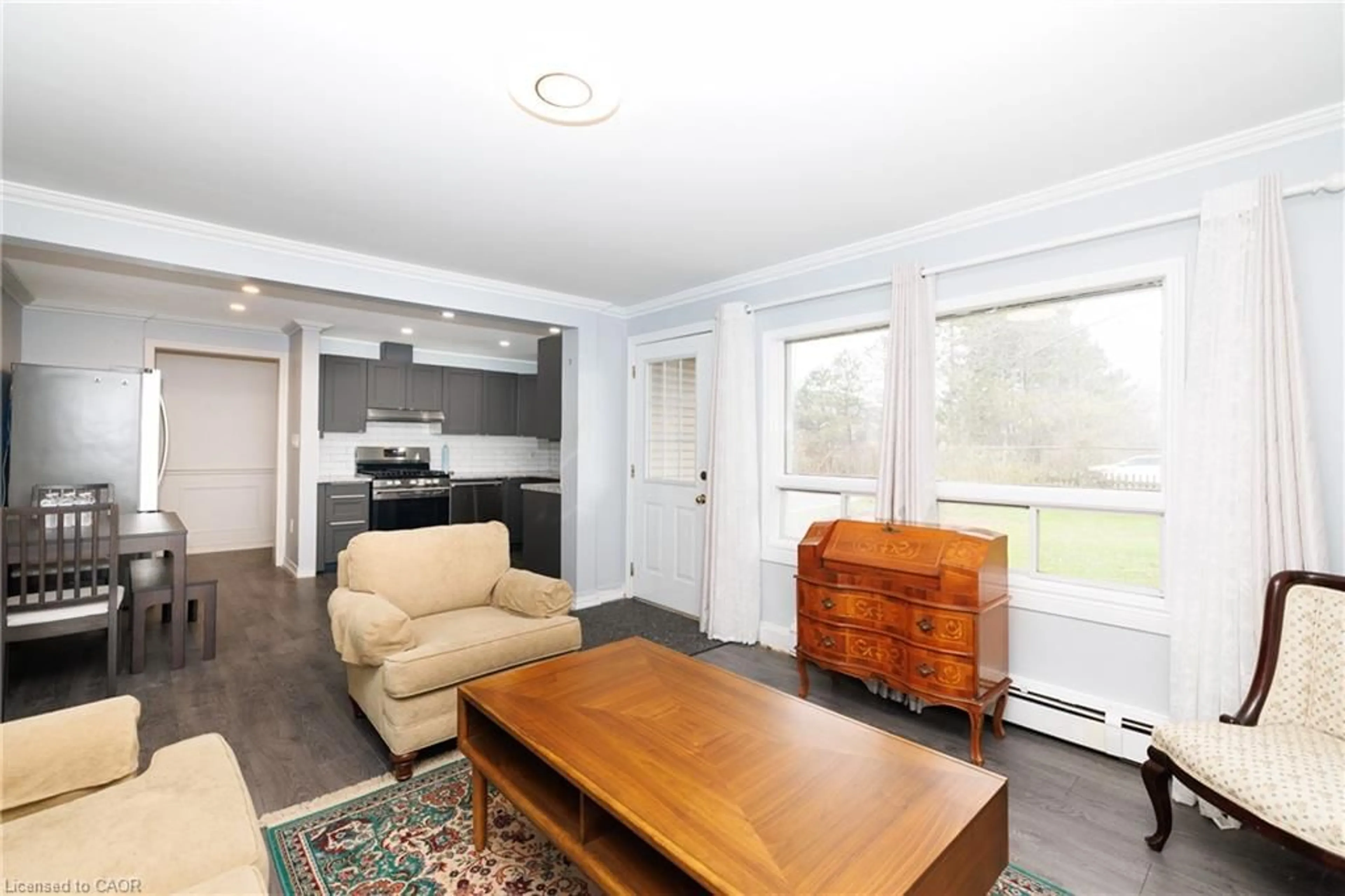 Living room with furniture, wood/laminate floor for 521 Marshall Rd, Dunnville Ontario N1A 2W8