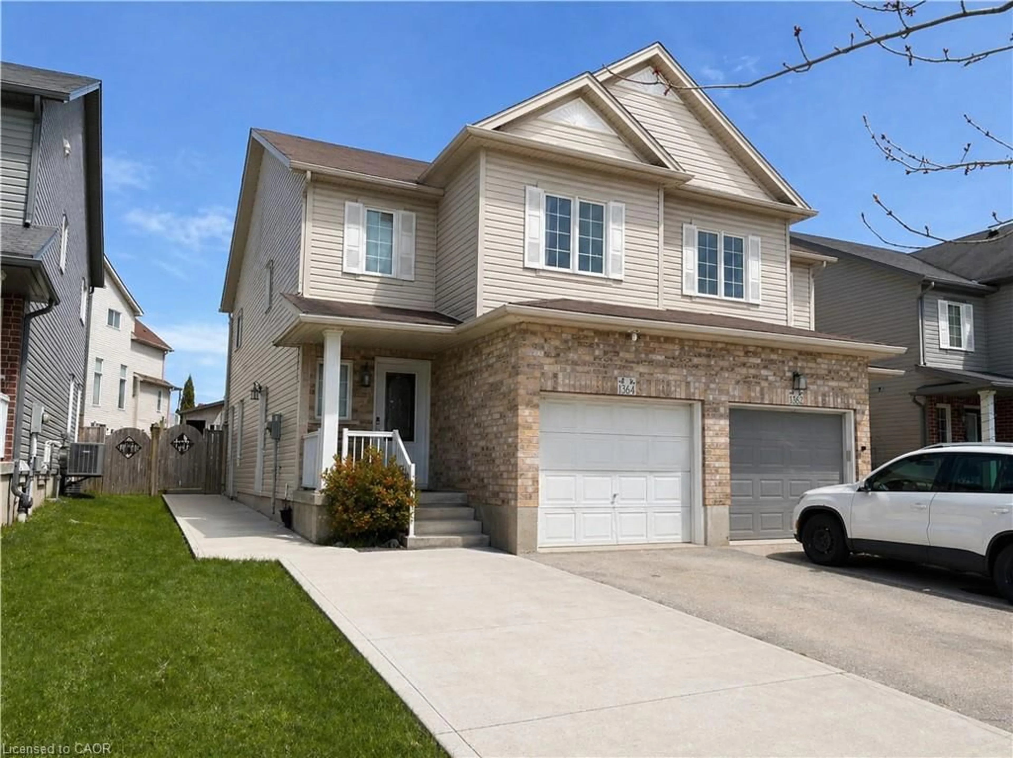 Home with brick exterior material, street for 1364 Countrystone Dr, Kitchener Ontario N2N 3R8