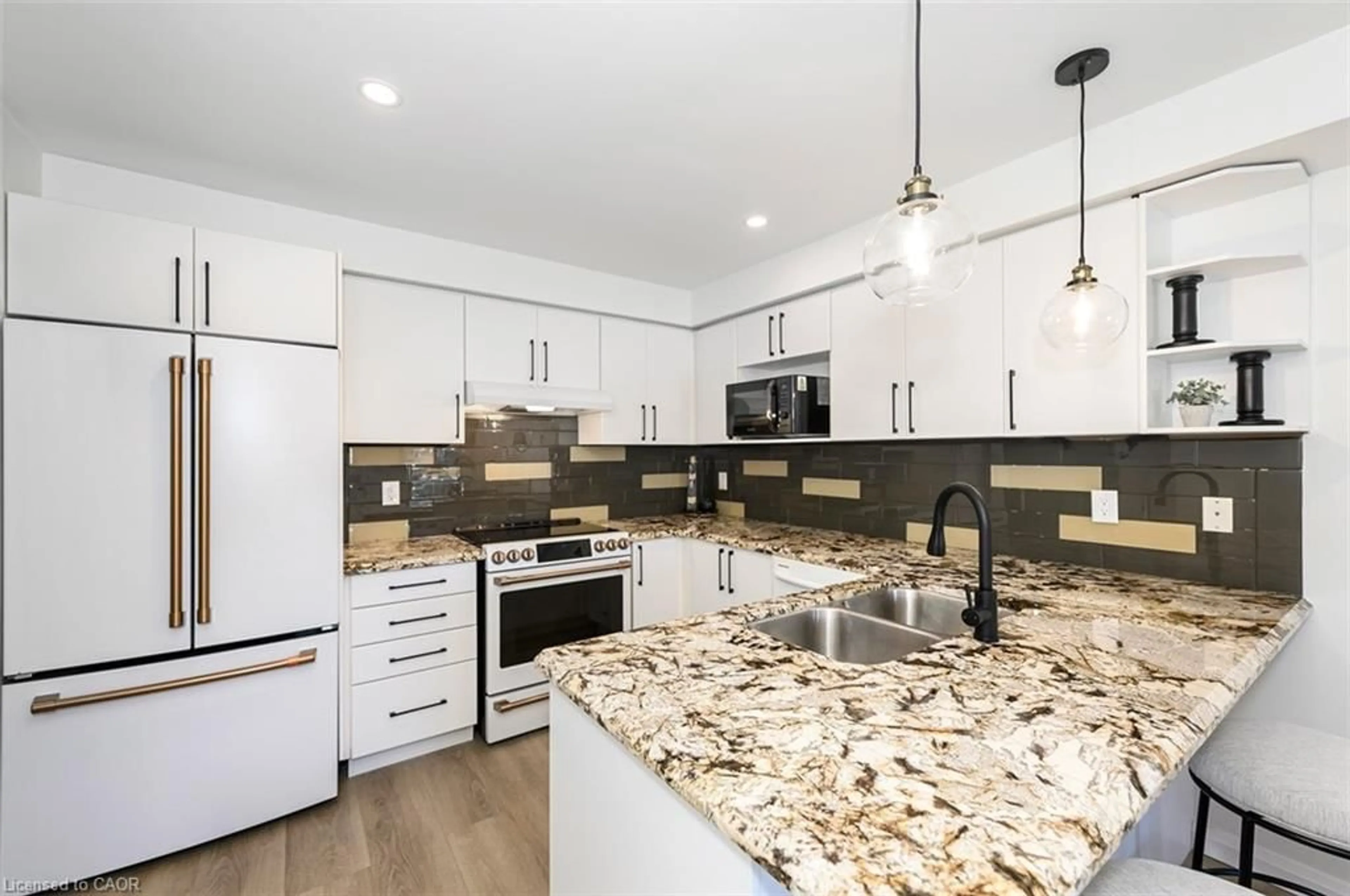 Open concept kitchen, ceramic/tile floor for 100 Manley Lane, Milton Ontario L9T 5N9