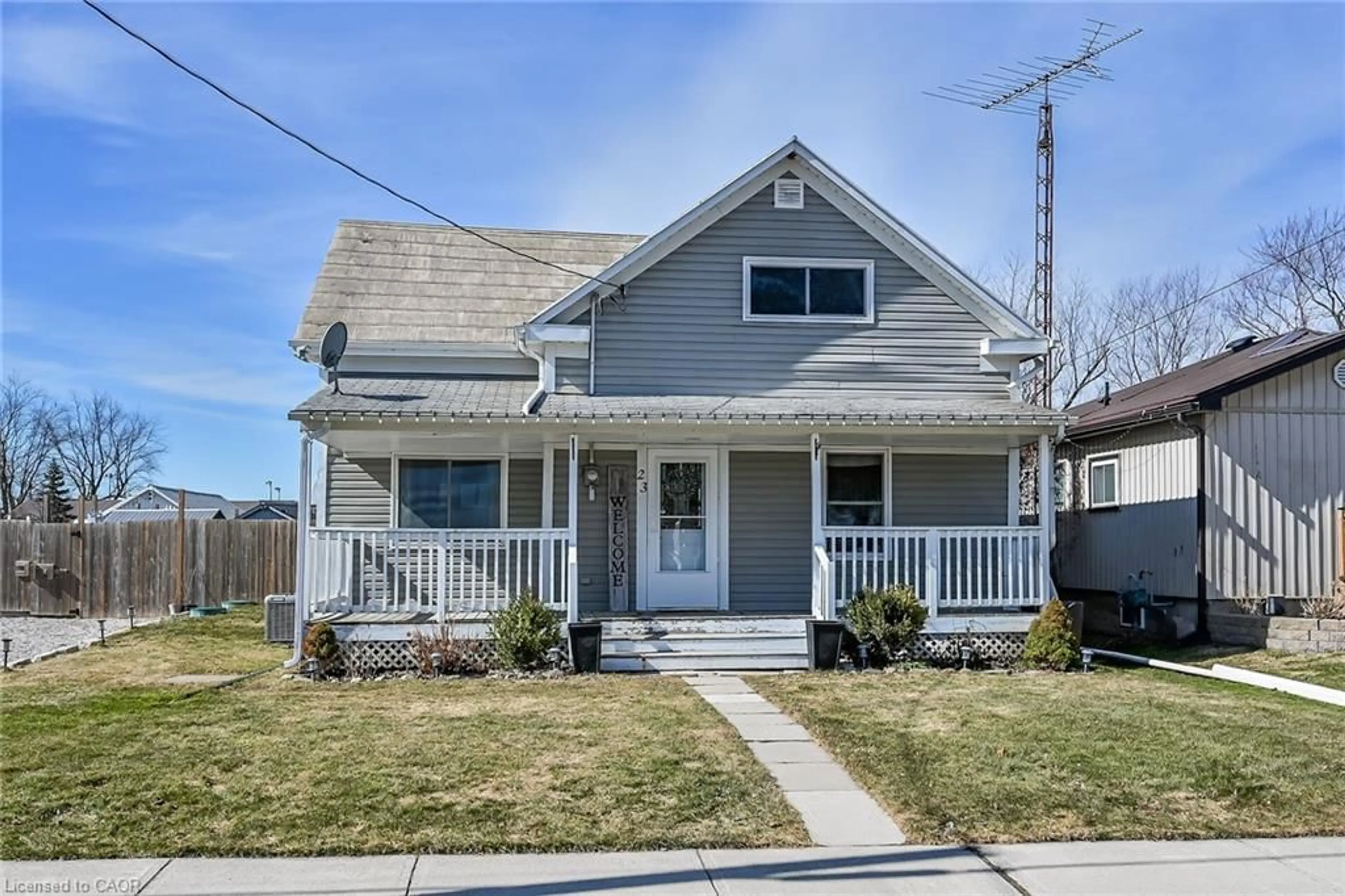 Home with vinyl exterior material, street for 23 Erie Ave, Fisherville Ontario N0A 1G0