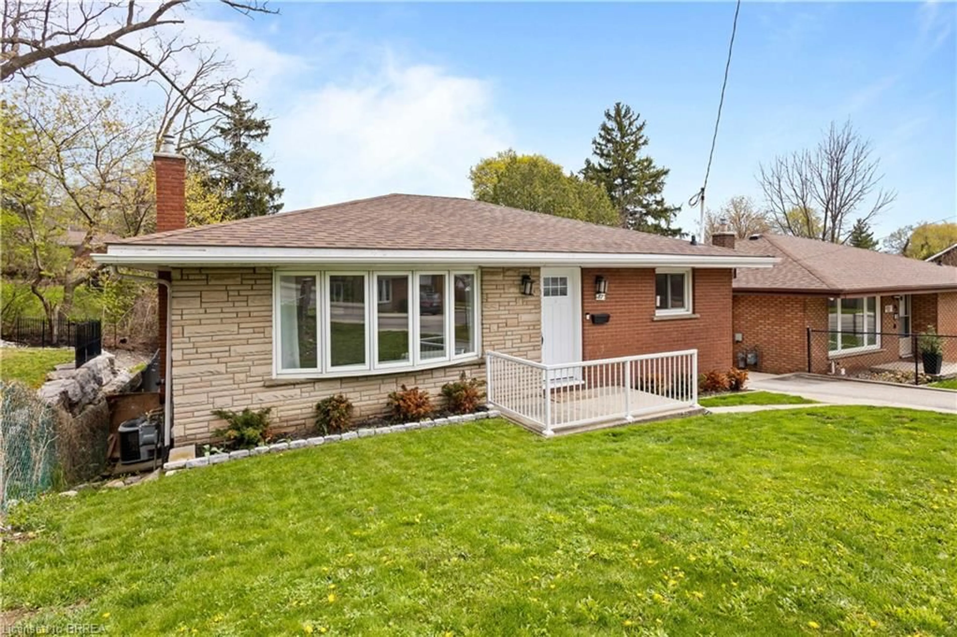 Home with brick exterior material, street for 87 St Paul Ave, Brantford Ontario N3T 4G1