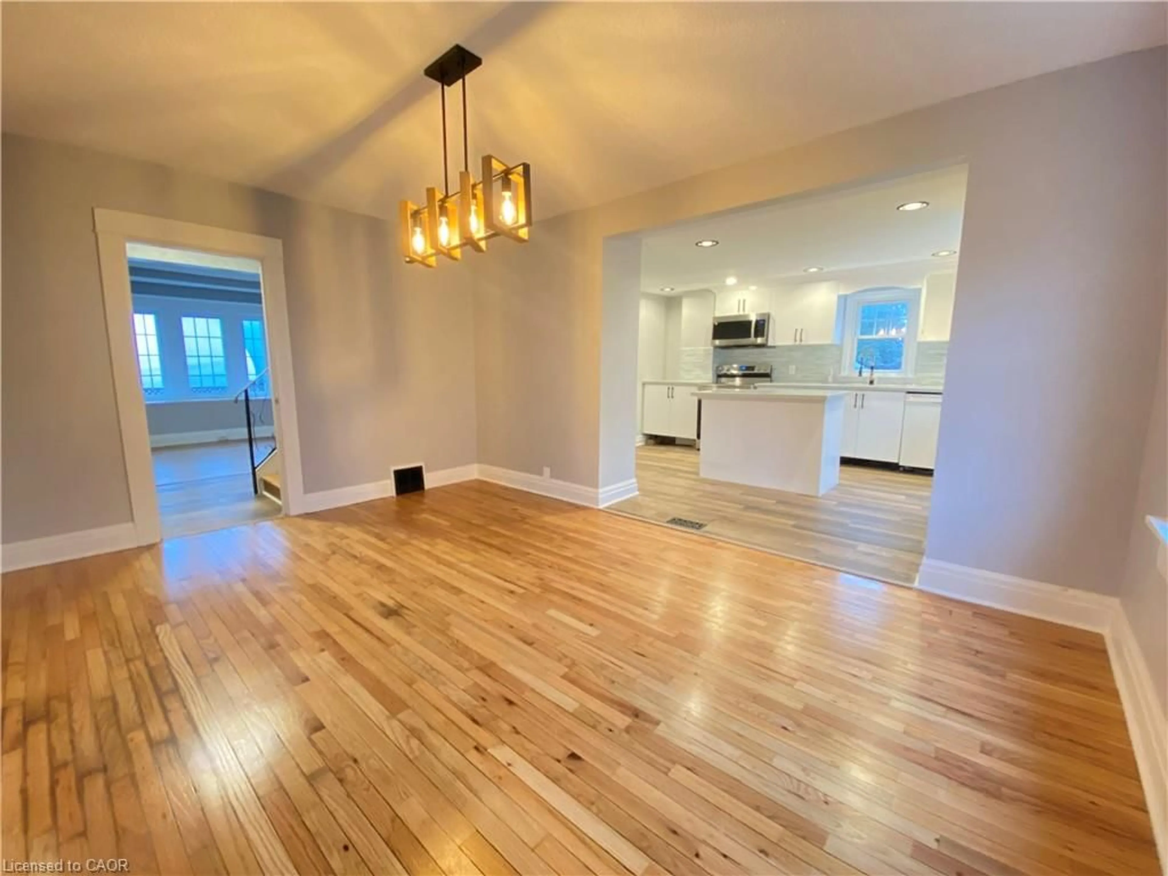 Open concept kitchen, wood/laminate floor for 168 Garside Ave, Hamilton Ontario L8H 4W6