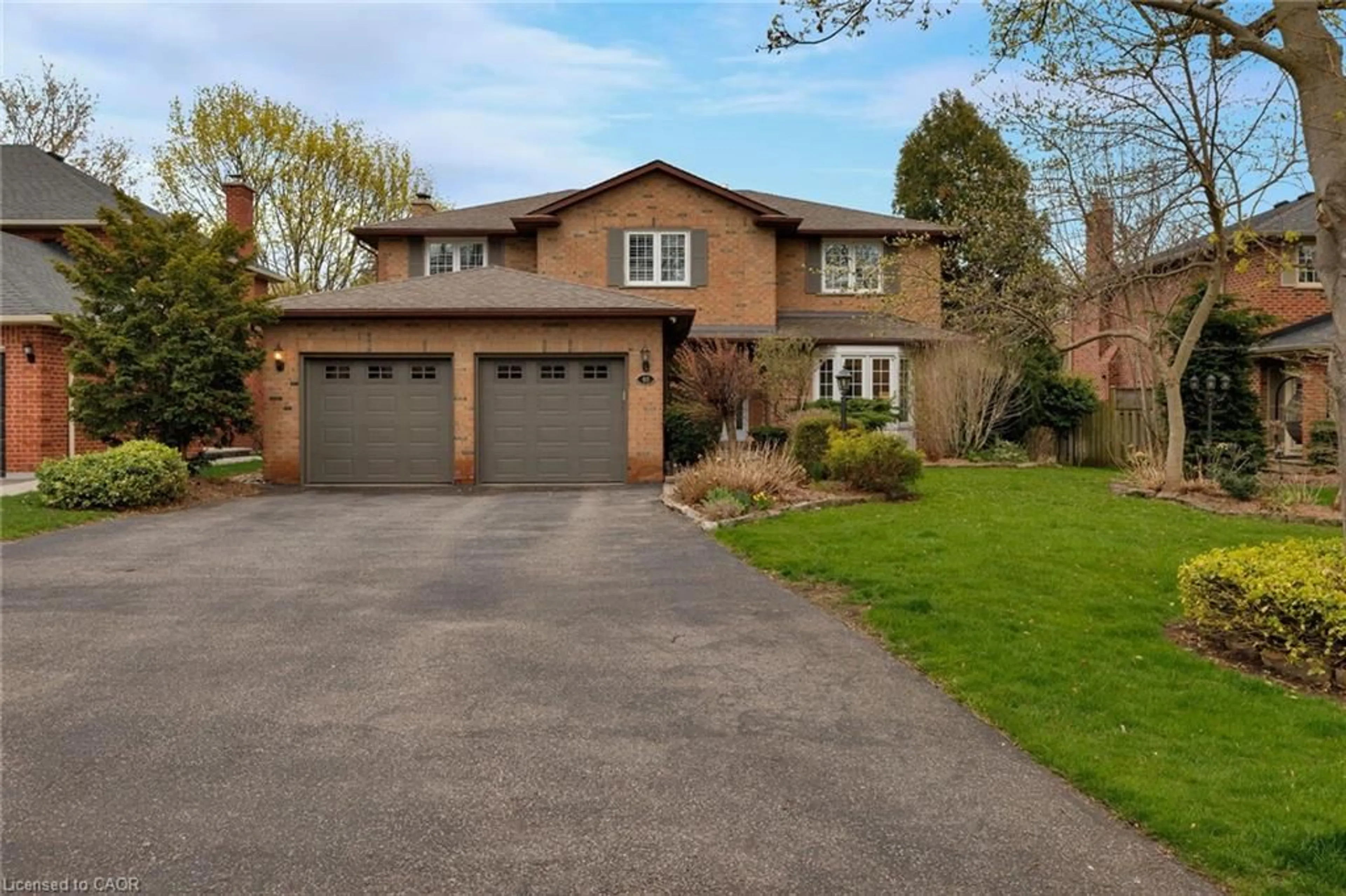 Home with brick exterior material, street for 48 Cudmore Rd, Oakville Ontario L6L 2Y5