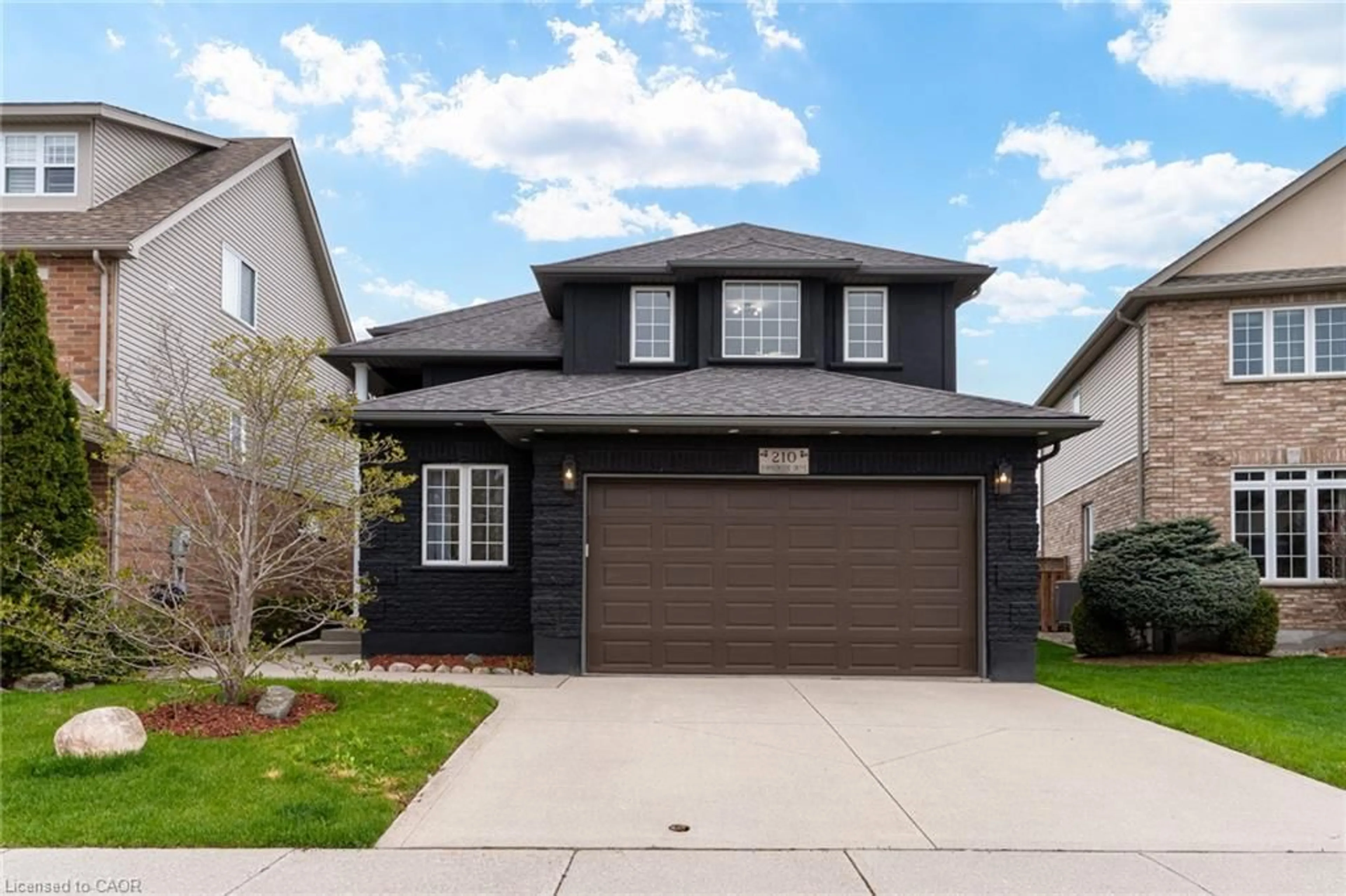 Home with brick exterior material, street for 210 Hawkswood Dr, Kitchener Ontario N2K 4J3