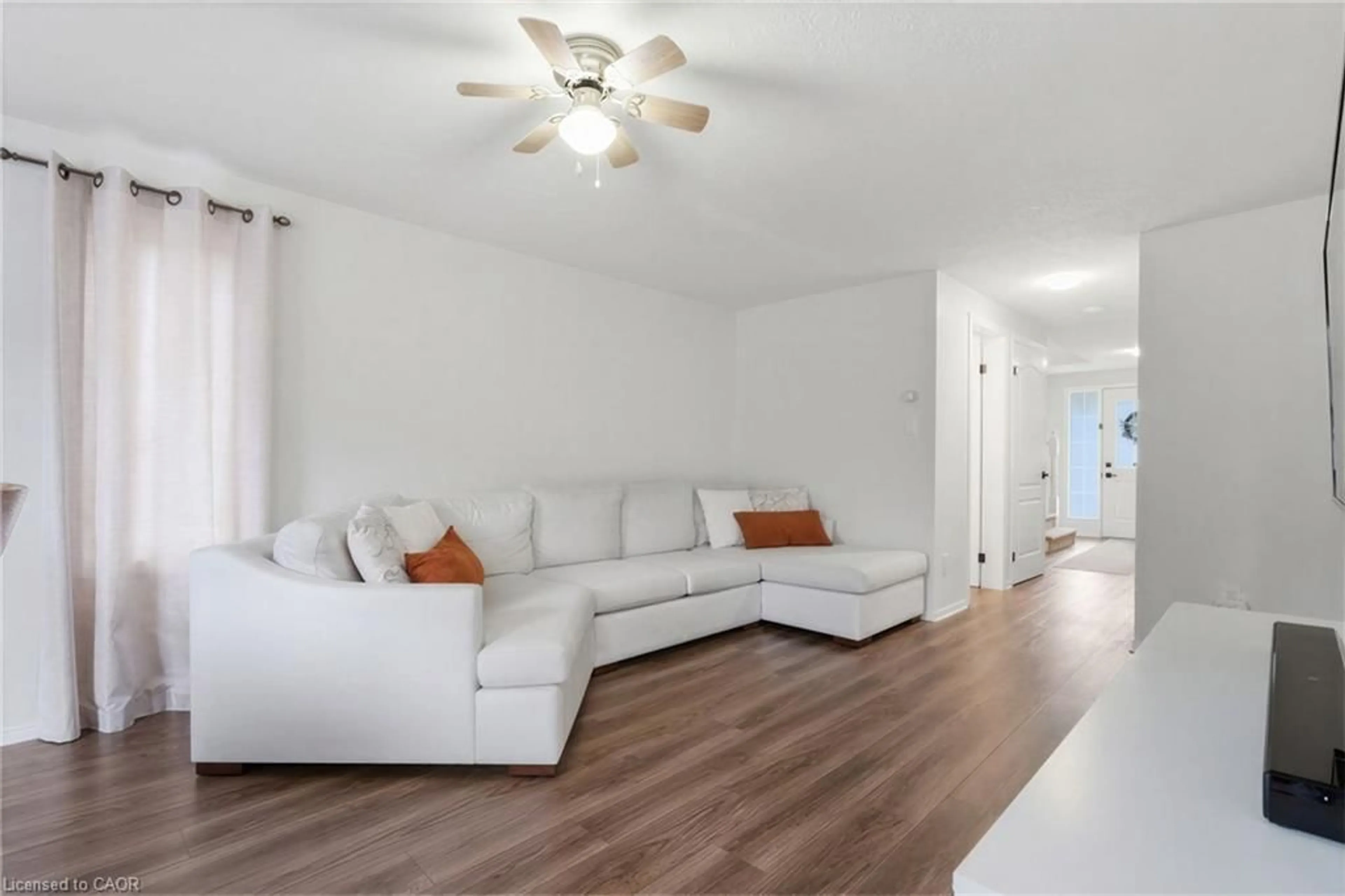 Living room with furniture, wood/laminate floor for 86 Brookmead St, Elmira Ontario N3B 3L9