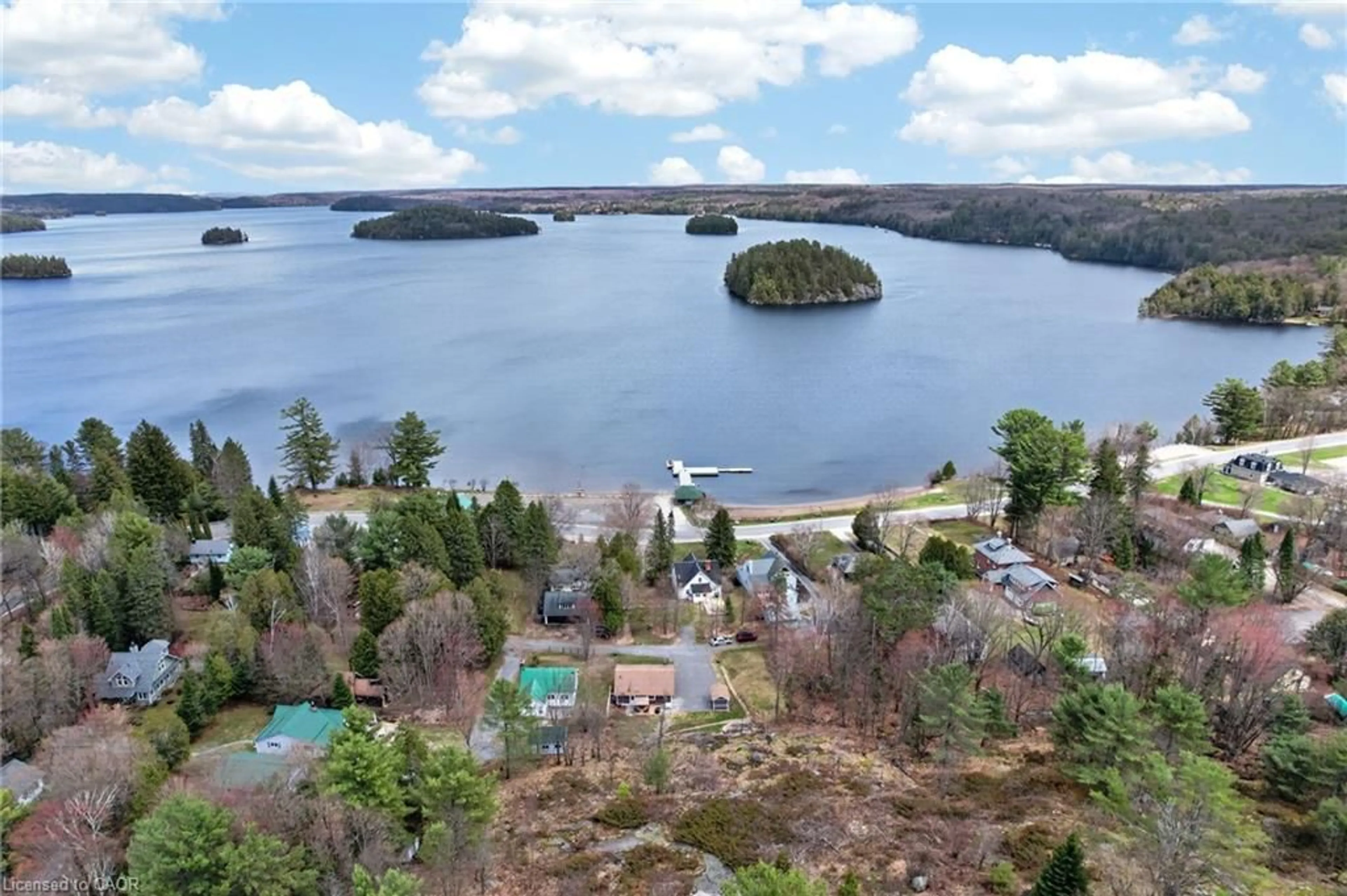 A pic from outside/outdoor area/front of a property/back of a property/a pic from drone, water/lake/river/ocean view for 17 Mcclure Lane, Port Sydney Ontario P0B 1L0