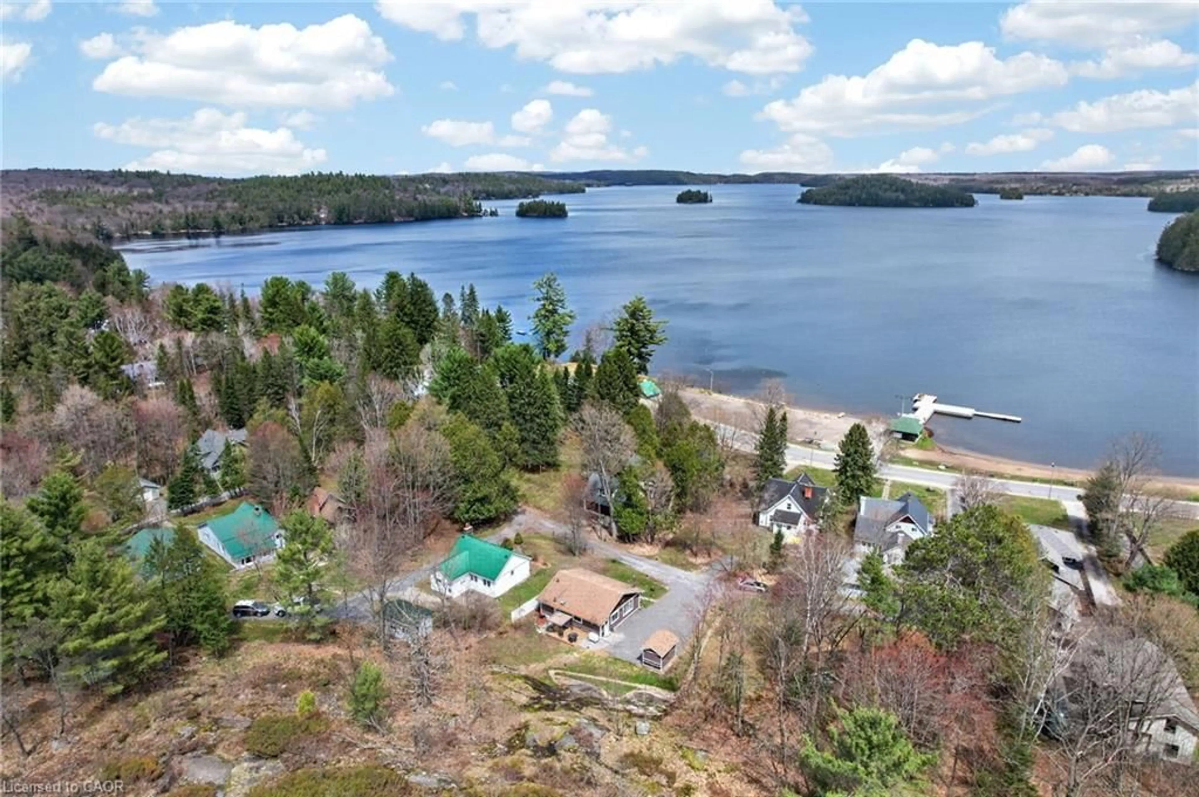 A pic from outside/outdoor area/front of a property/back of a property/a pic from drone, water/lake/river/ocean view for 17 Mcclure Lane, Port Sydney Ontario P0B 1L0