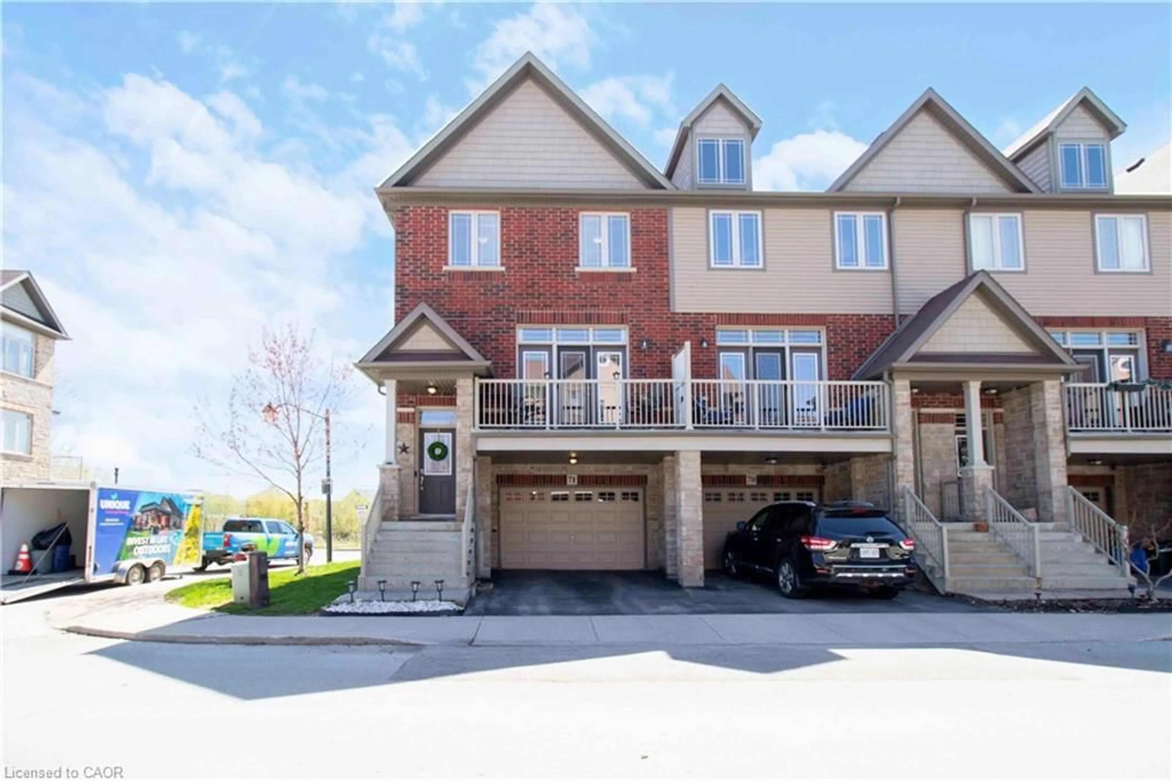 A pic from outside/outdoor area/front of a property/back of a property/a pic from drone, street for 310 Fall Fair Way #71, Binbrook Ontario L0R 1C0