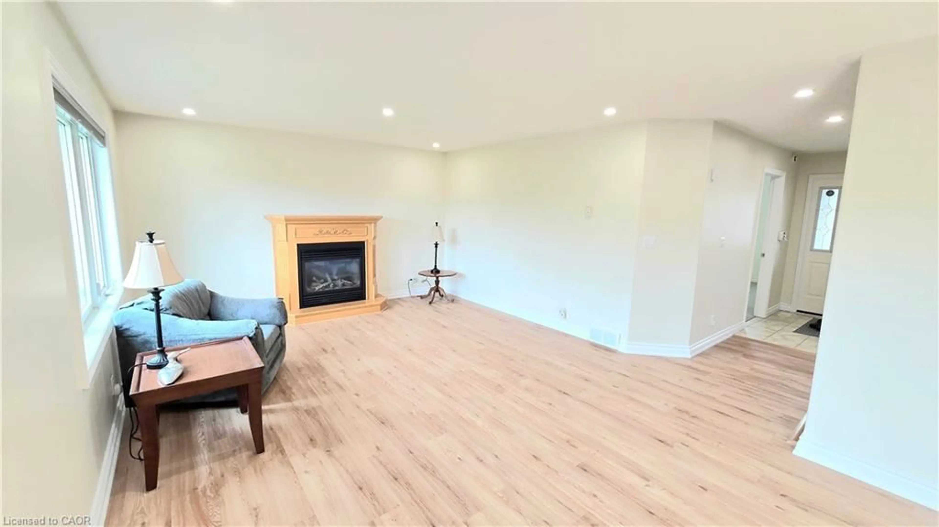 Living room with furniture, wood/laminate floor for 451 Queen St, Simcoe Ontario N3Y 5N1