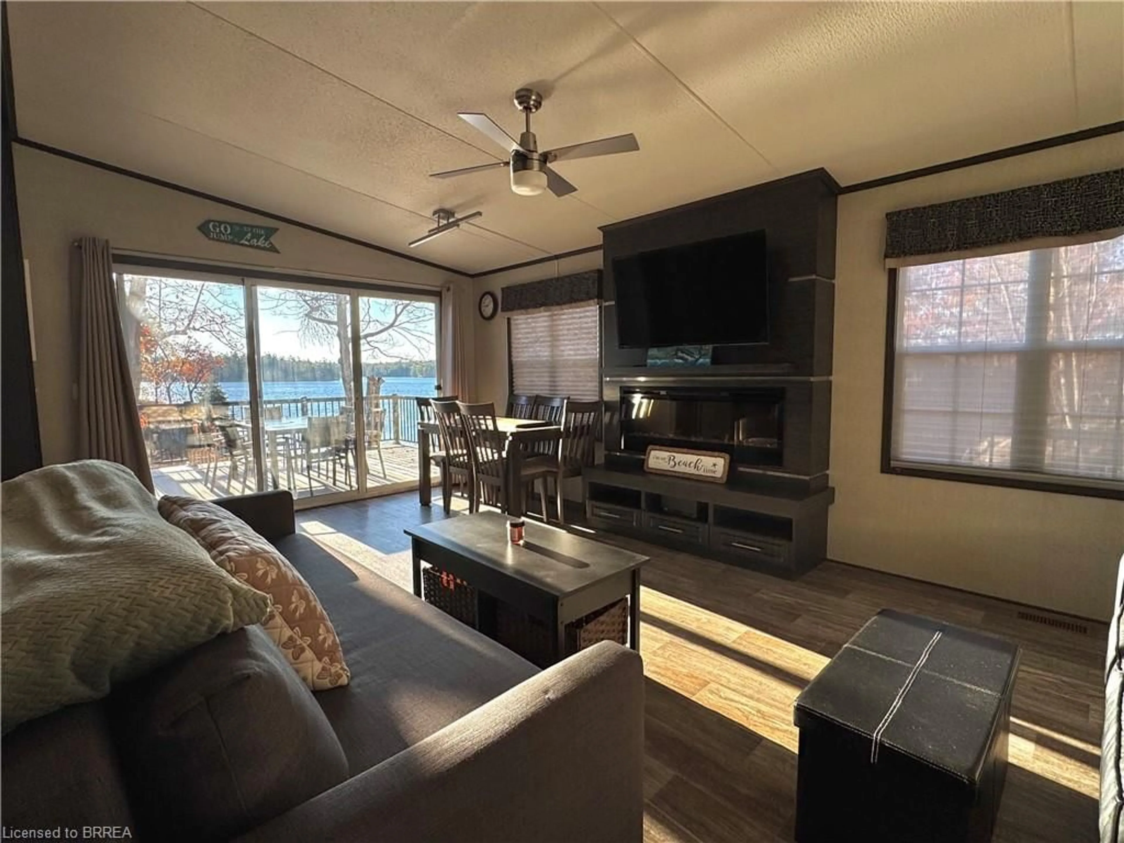 Living room with furniture, wood/laminate floor for 1336 South Morrison Lake Rd #23 Riverside, Kilworthy Ontario P0E 1G0