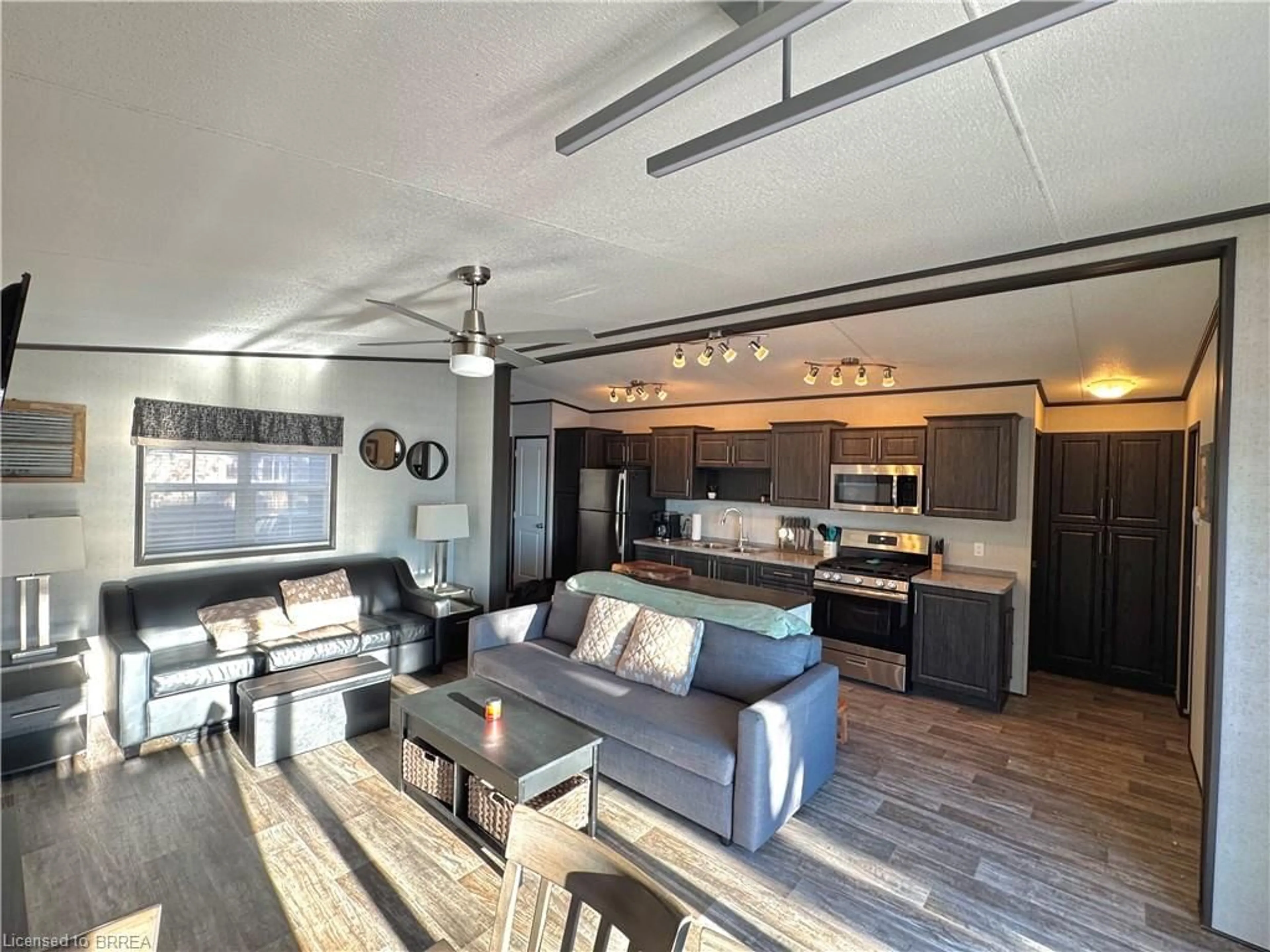 Open concept kitchen, wood/laminate floor for 1336 South Morrison Lake Rd #23 Riverside, Kilworthy Ontario P0E 1G0