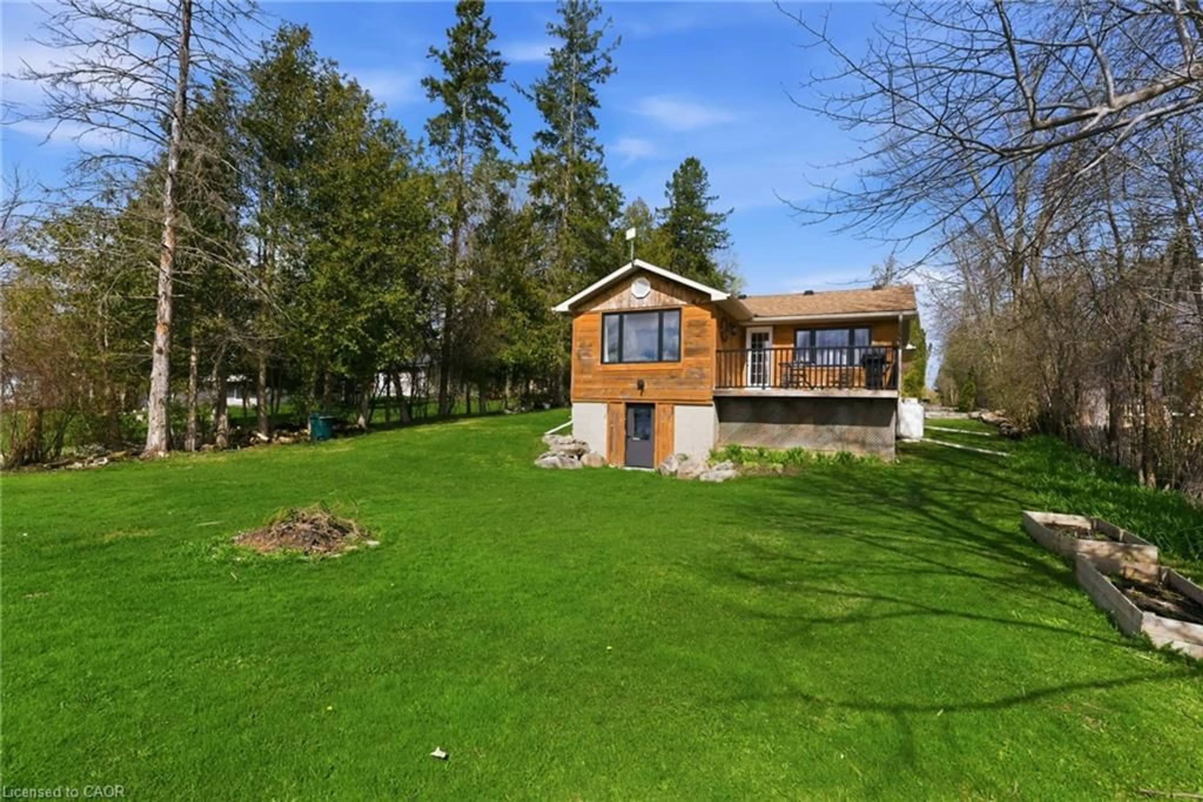 A pic from outside/outdoor area/front of a property/back of a property/a pic from drone, water/lake/river/ocean view for 38 Cowans Cres, Omemee Ontario K0L 2W0