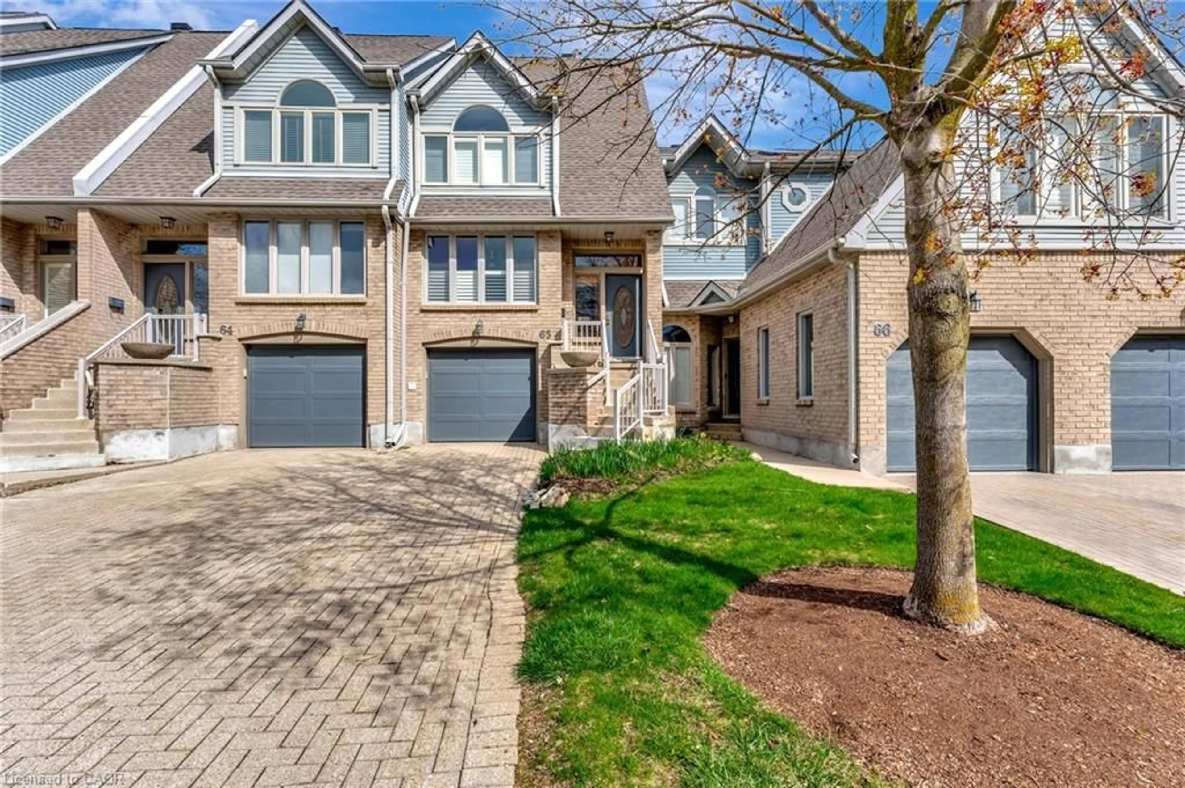 Home with brick exterior material, street for 225 Benjamin Rd #65, Waterloo Ontario N2V 1Z3