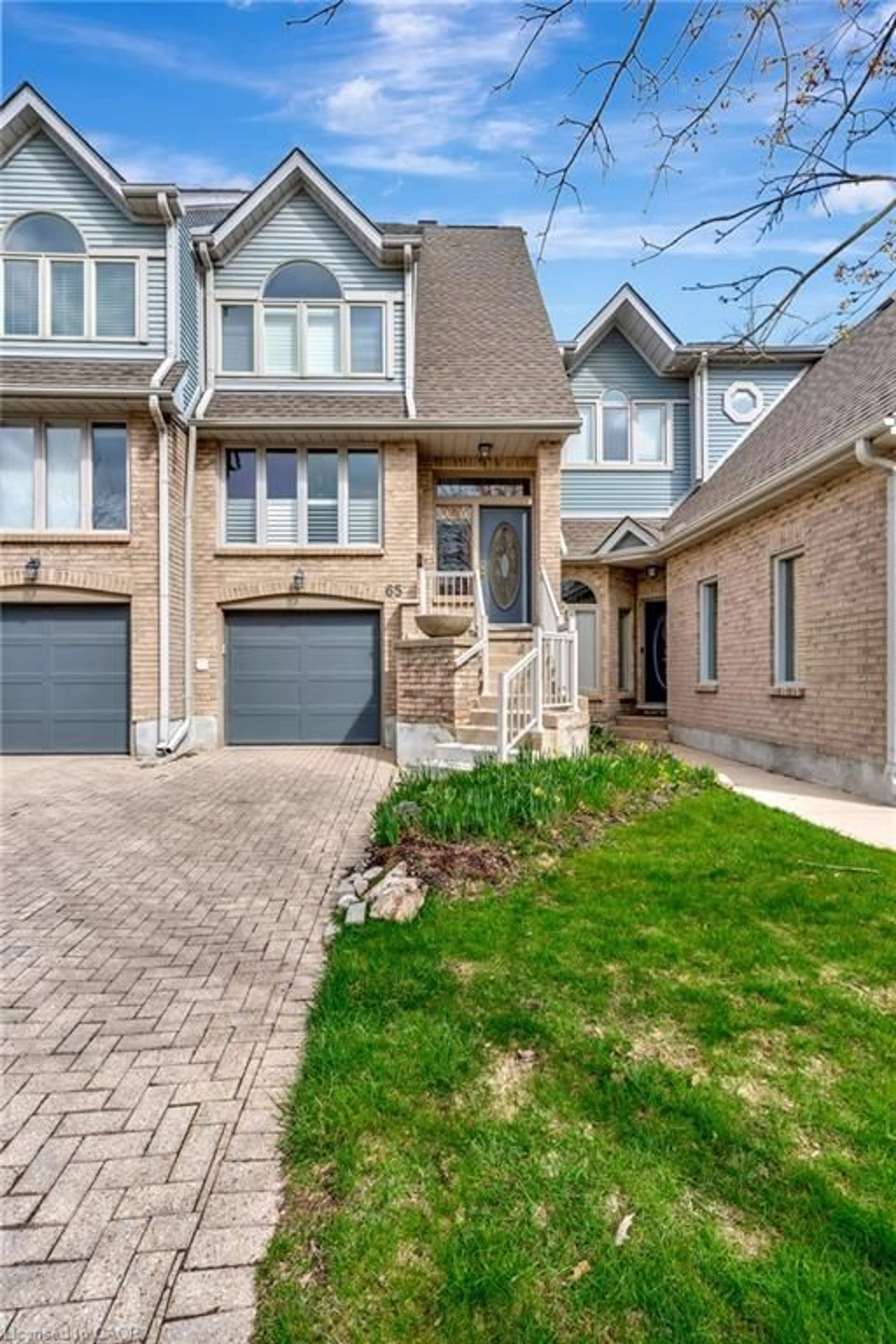 Home with brick exterior material, street for 225 Benjamin Rd #65, Waterloo Ontario N2V 1Z3