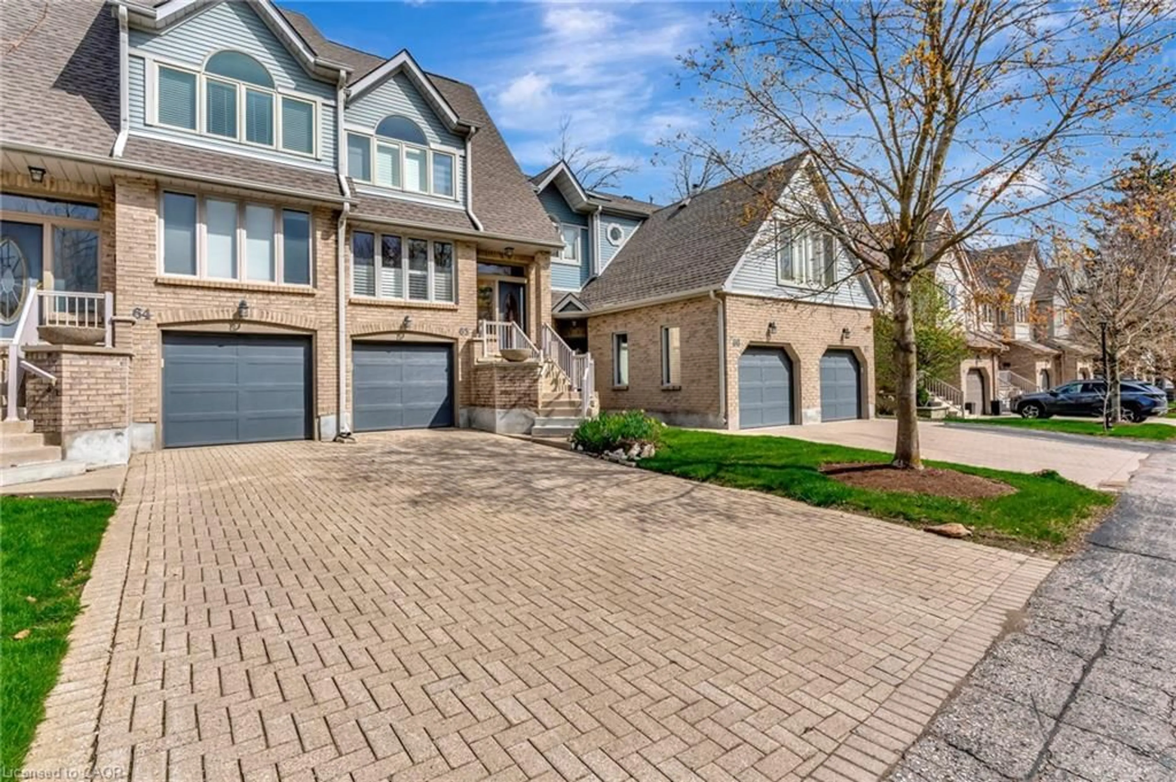 Home with brick exterior material, street for 225 Benjamin Rd #65, Waterloo Ontario N2V 1Z3