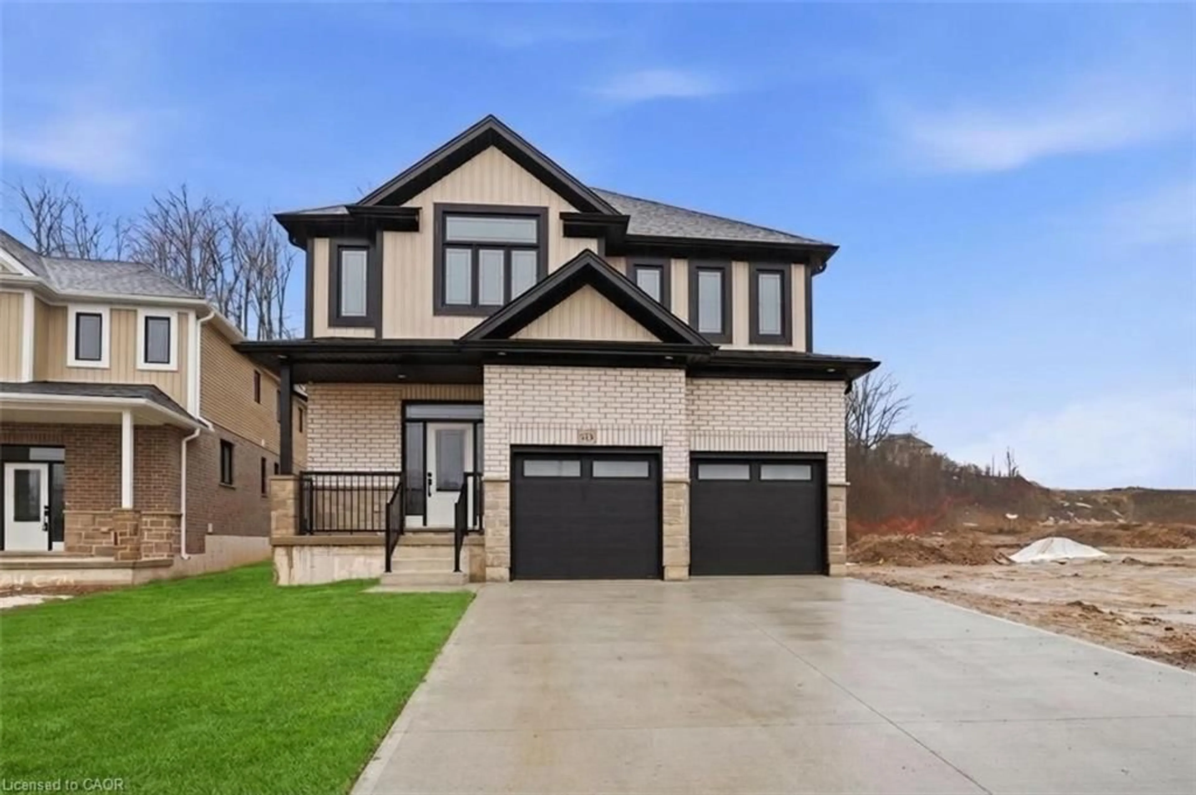 Home with brick exterior material, street for 70 Quarry Park Dr, Kitchener Ontario N2B 3F7