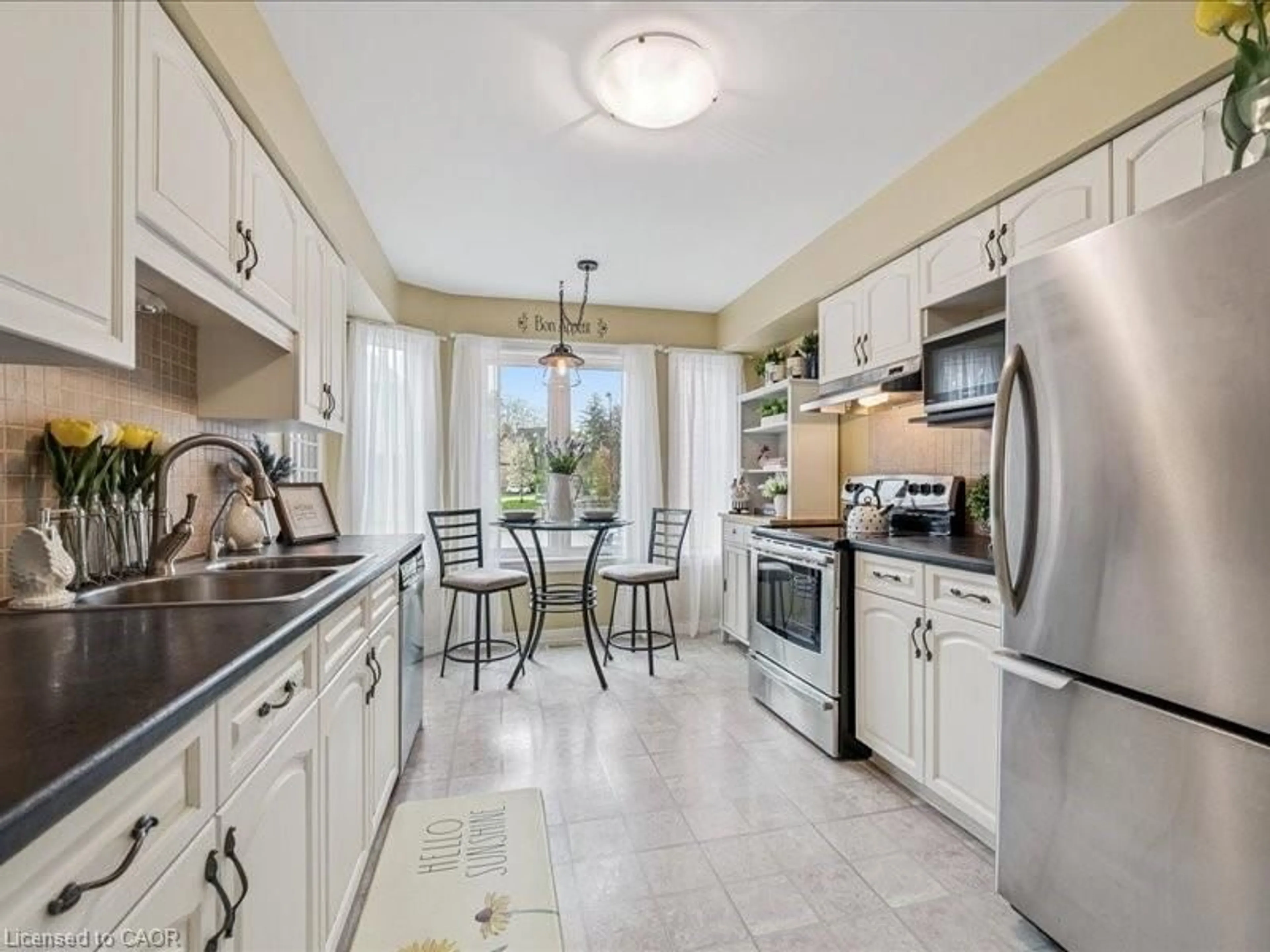 Open concept kitchen, ceramic/tile floor for 245 Bishop St #4, Cambridge Ontario N3H 5N2