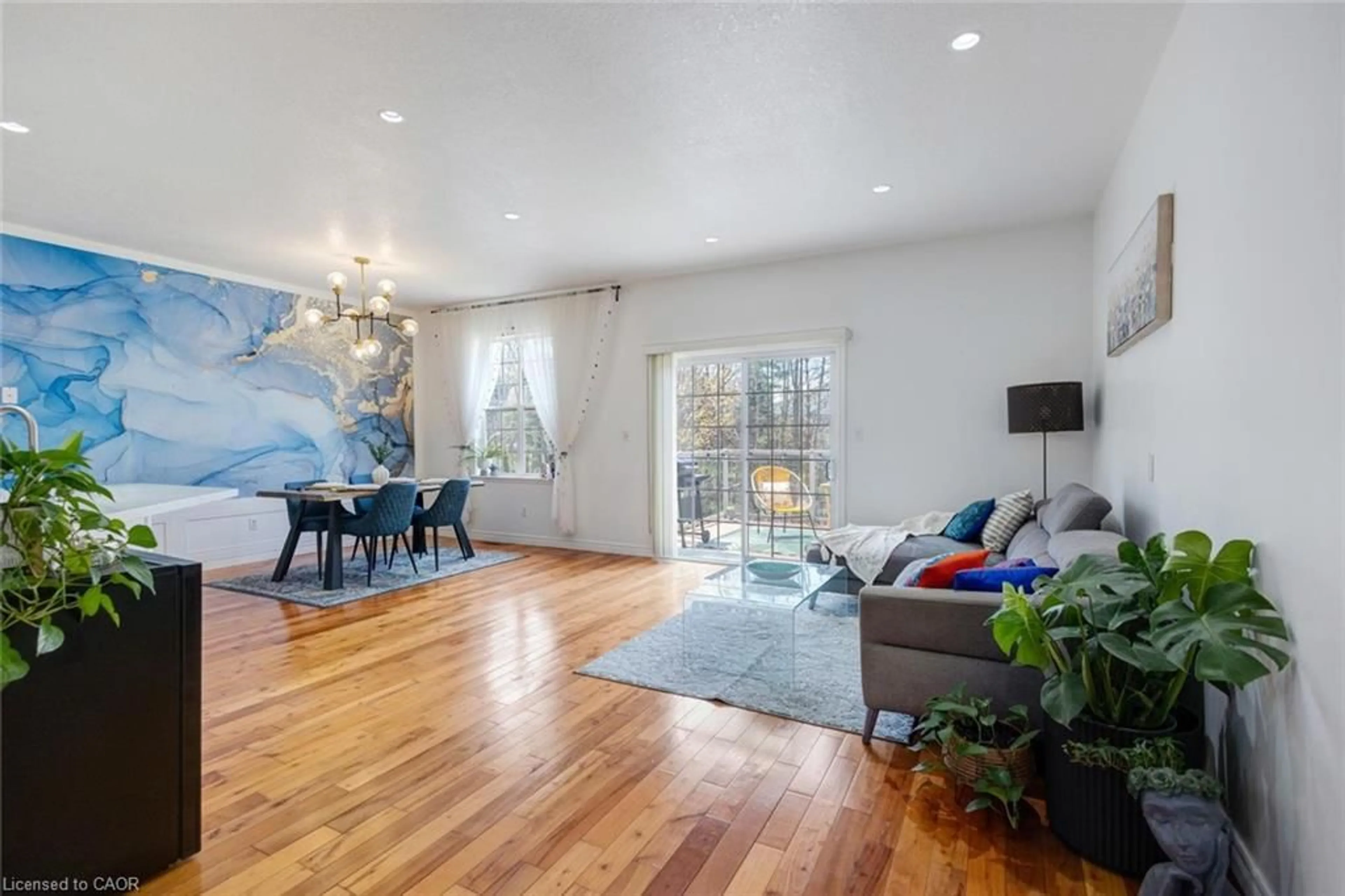 Living room with furniture, wood/laminate floor for 483 Parrott Pl, Woodstock Ontario N4T 1V8