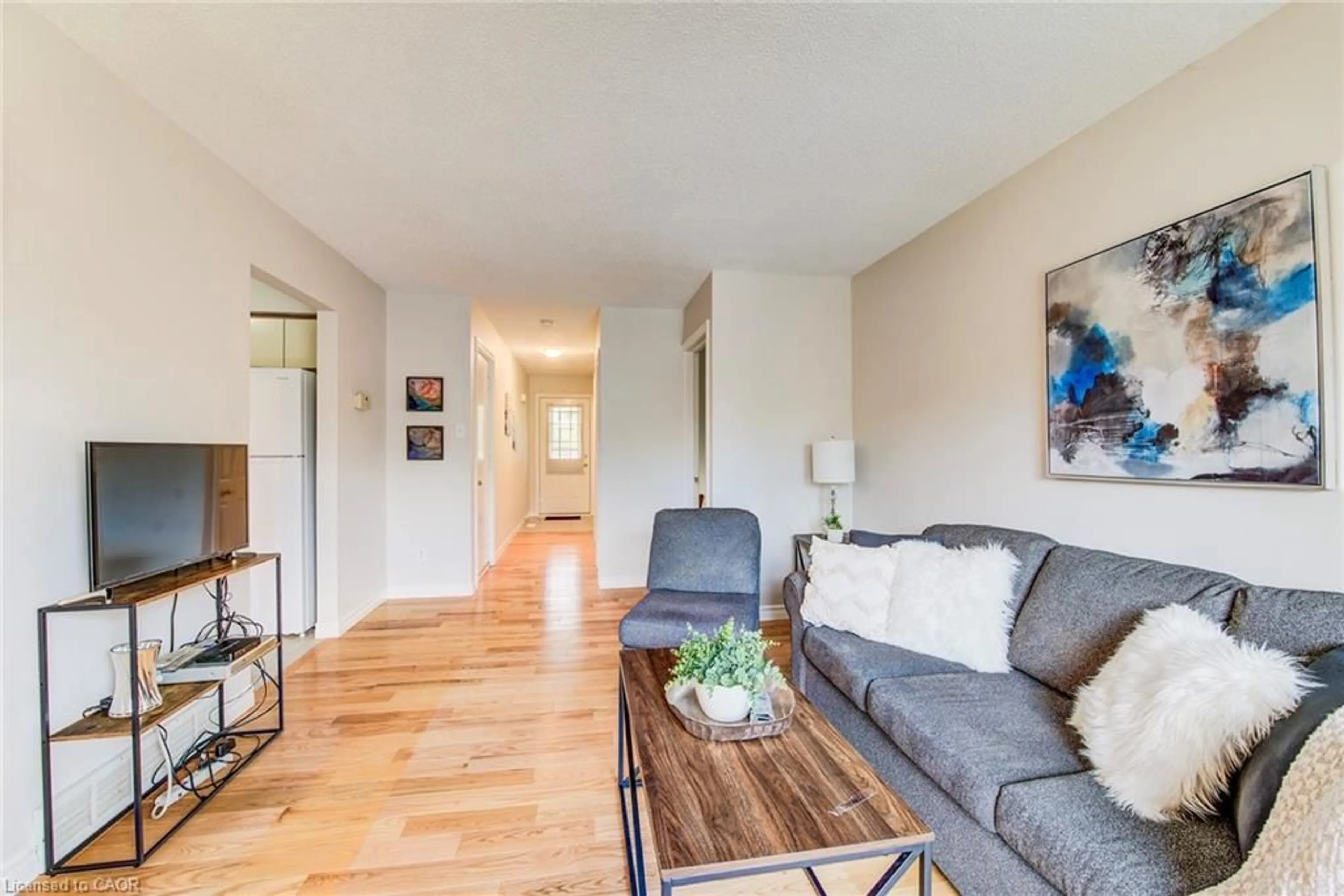 Living room with furniture, wood/laminate floor for 79 Brembel St, Kitchener Ontario N2B 3T7