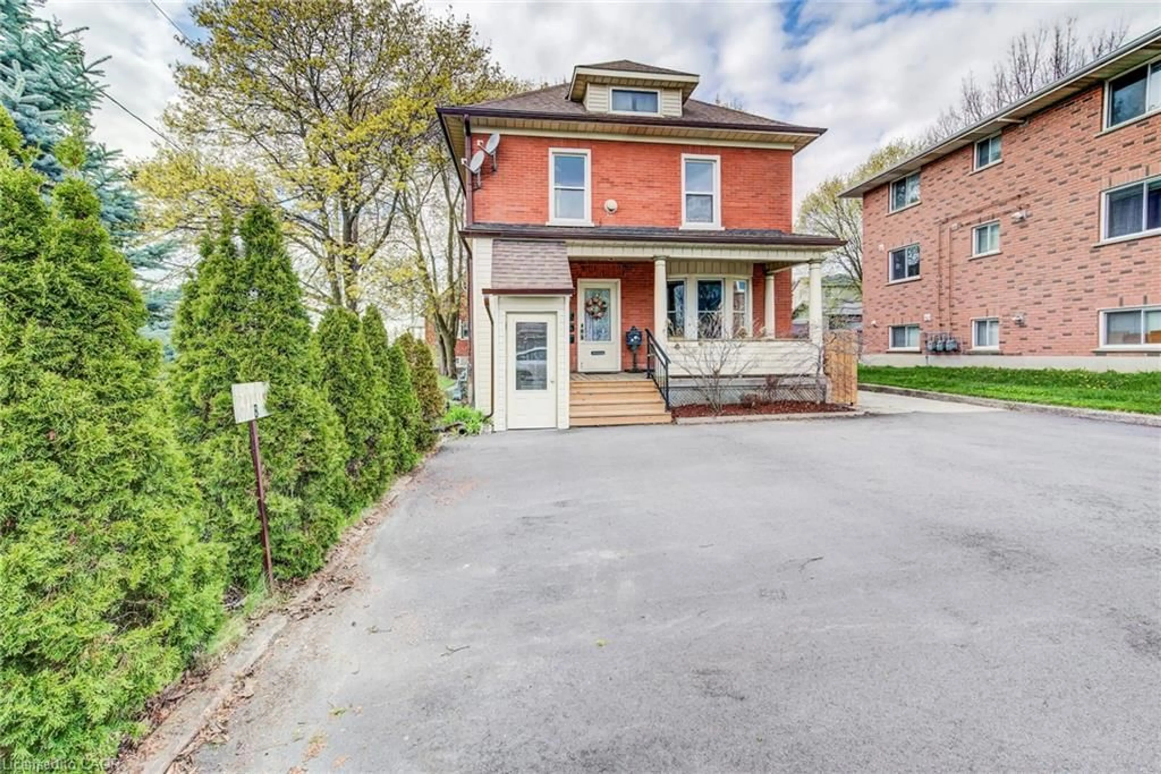 Home with brick exterior material, street for 306 Guelph St, Kitchener Ontario N2H 5X3