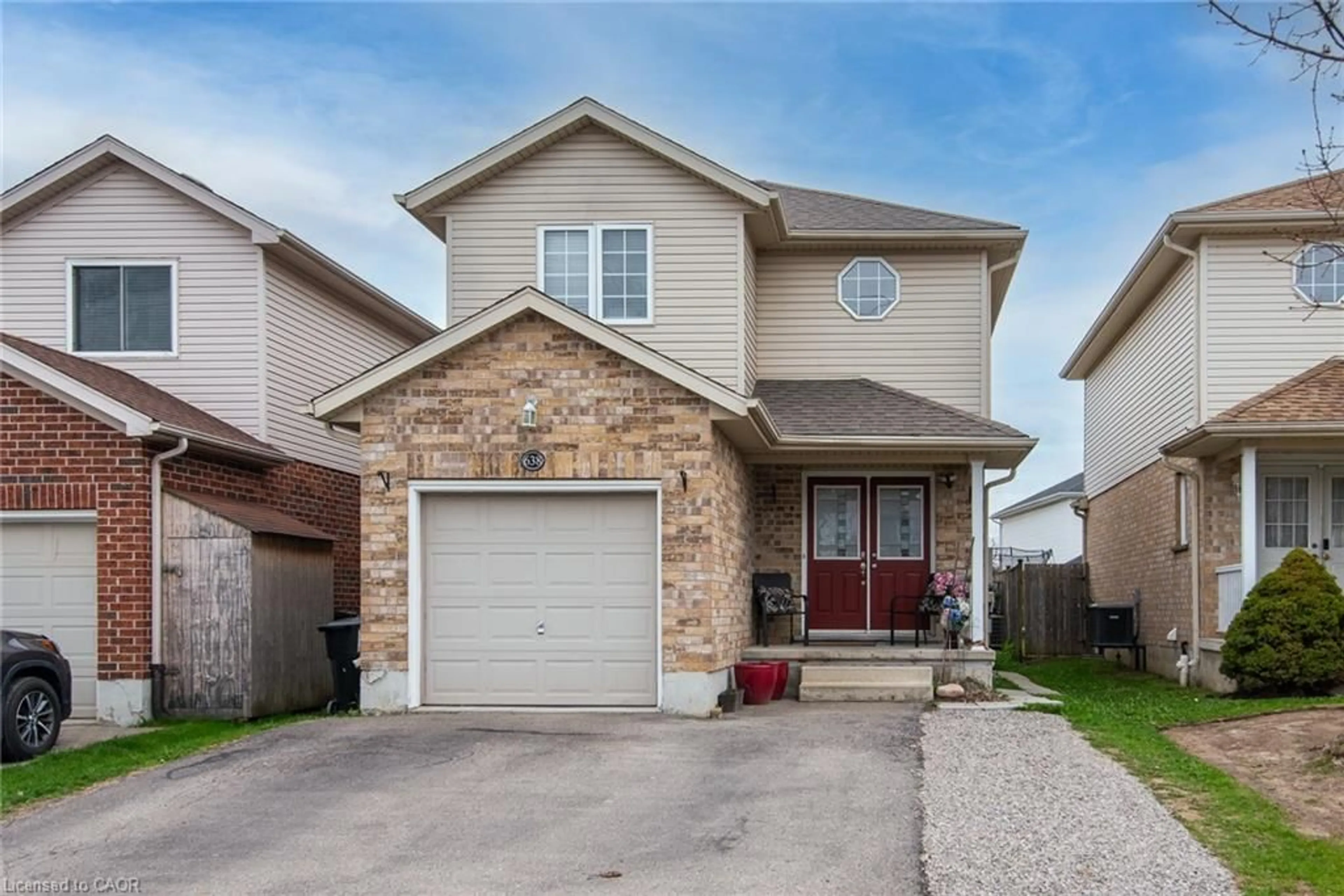 Home with brick exterior material, street for 638 Windflower Cres, Kitchener Ontario N2E 3S9