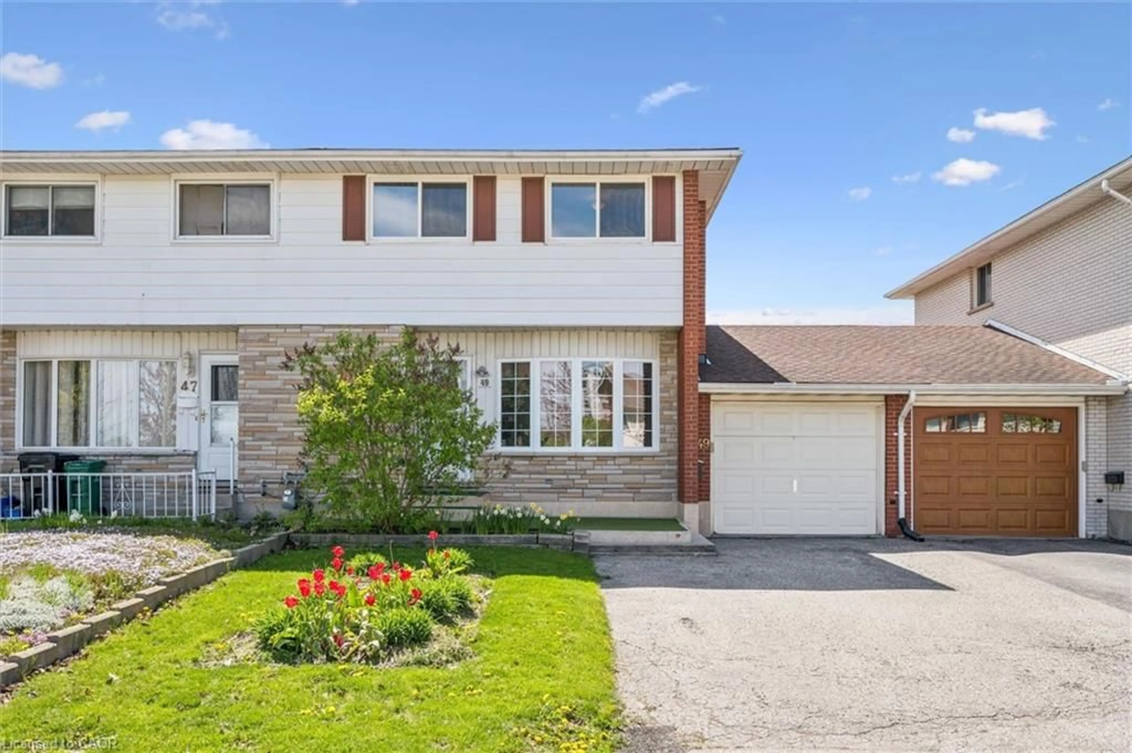 Home with vinyl exterior material, street for 49 Overlea Dr, Kitchener Ontario N2M 1S9