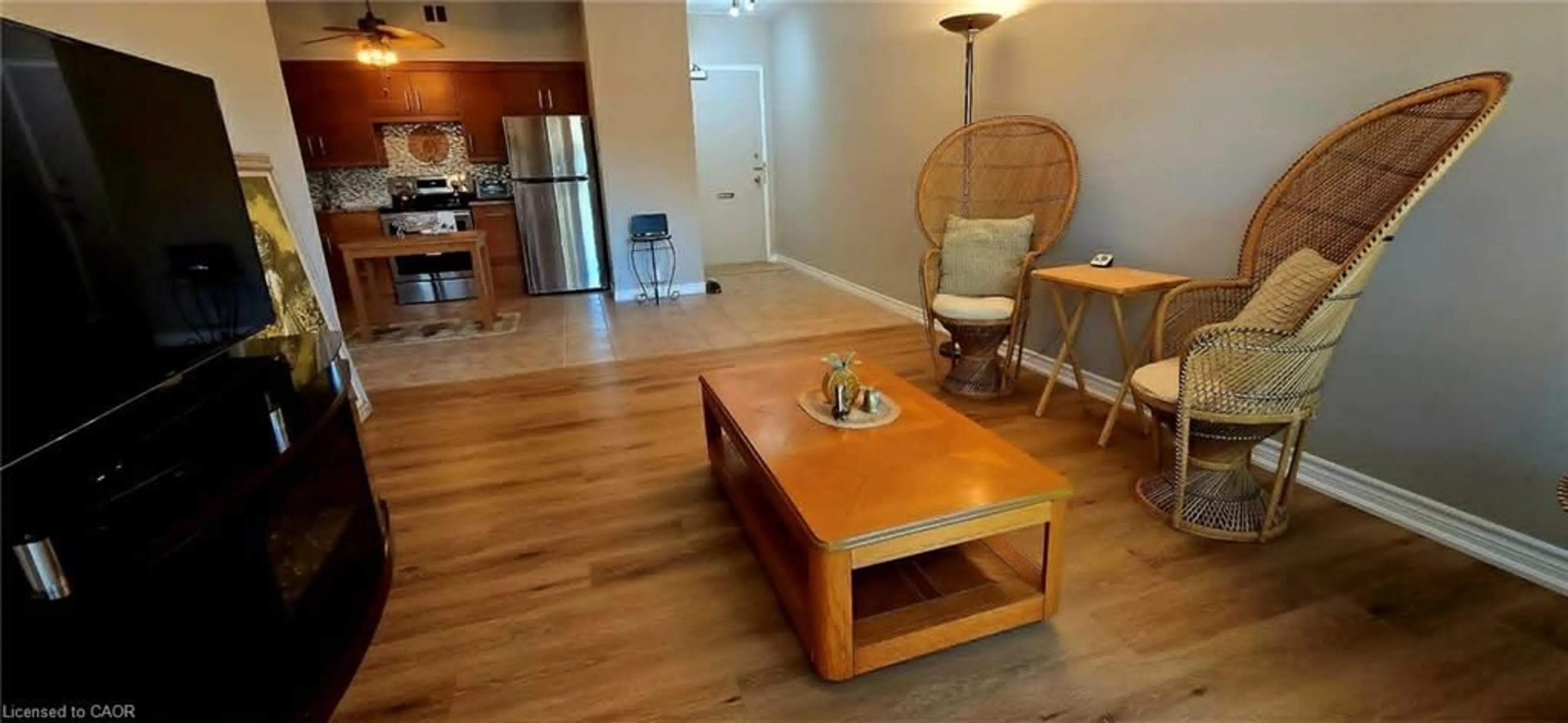 Living room with furniture, wood/laminate floor for 10 Woodman Dr #108, Hamilton Ontario L8K 4E1