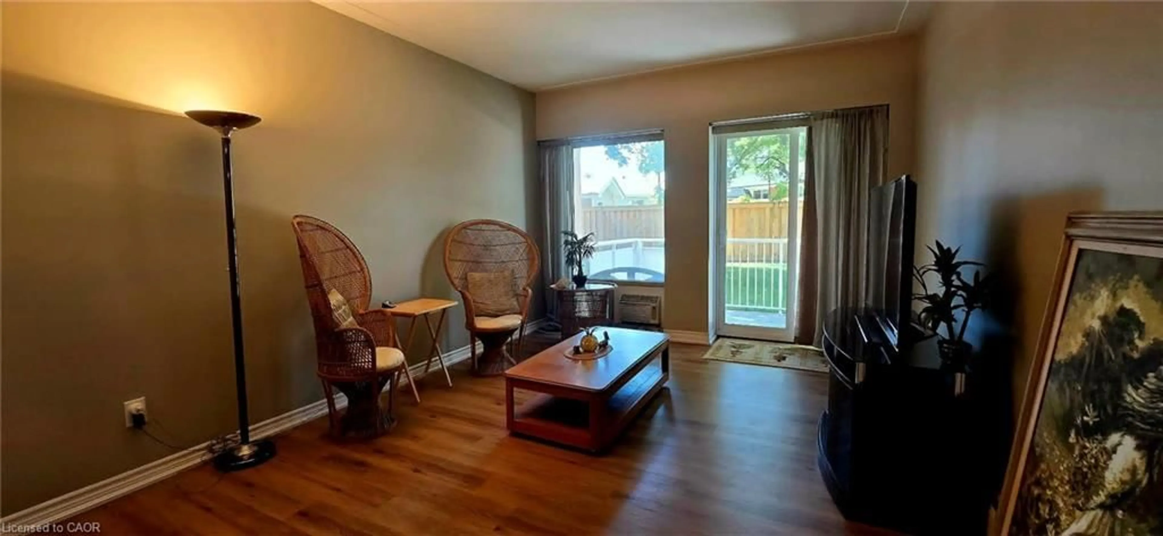 Living room with furniture, wood/laminate floor for 10 Woodman Dr #108, Hamilton Ontario L8K 4E1