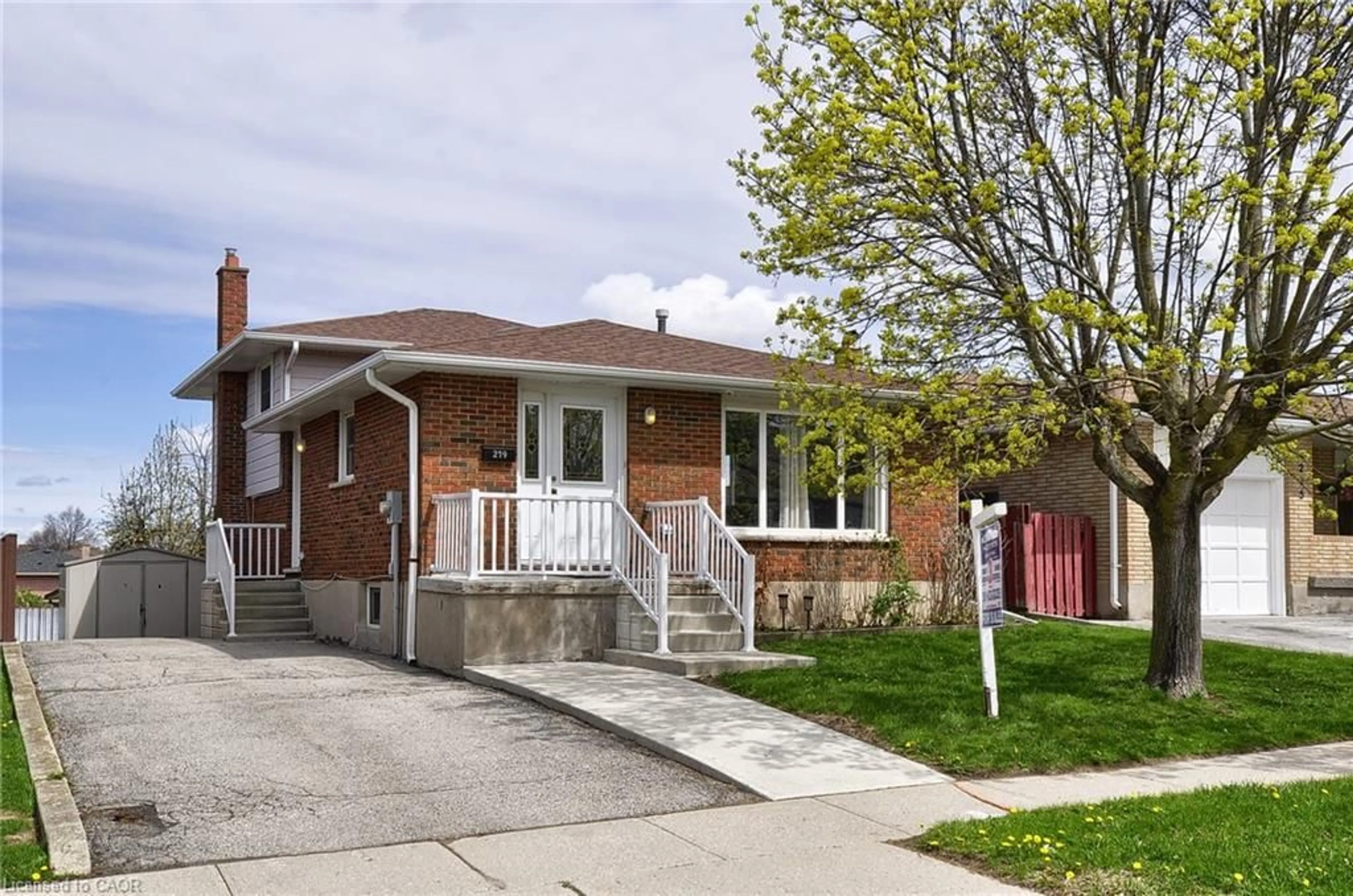Home with brick exterior material, street for 219 Bakersfield Dr, Cambridge Ontario N1R 6X9