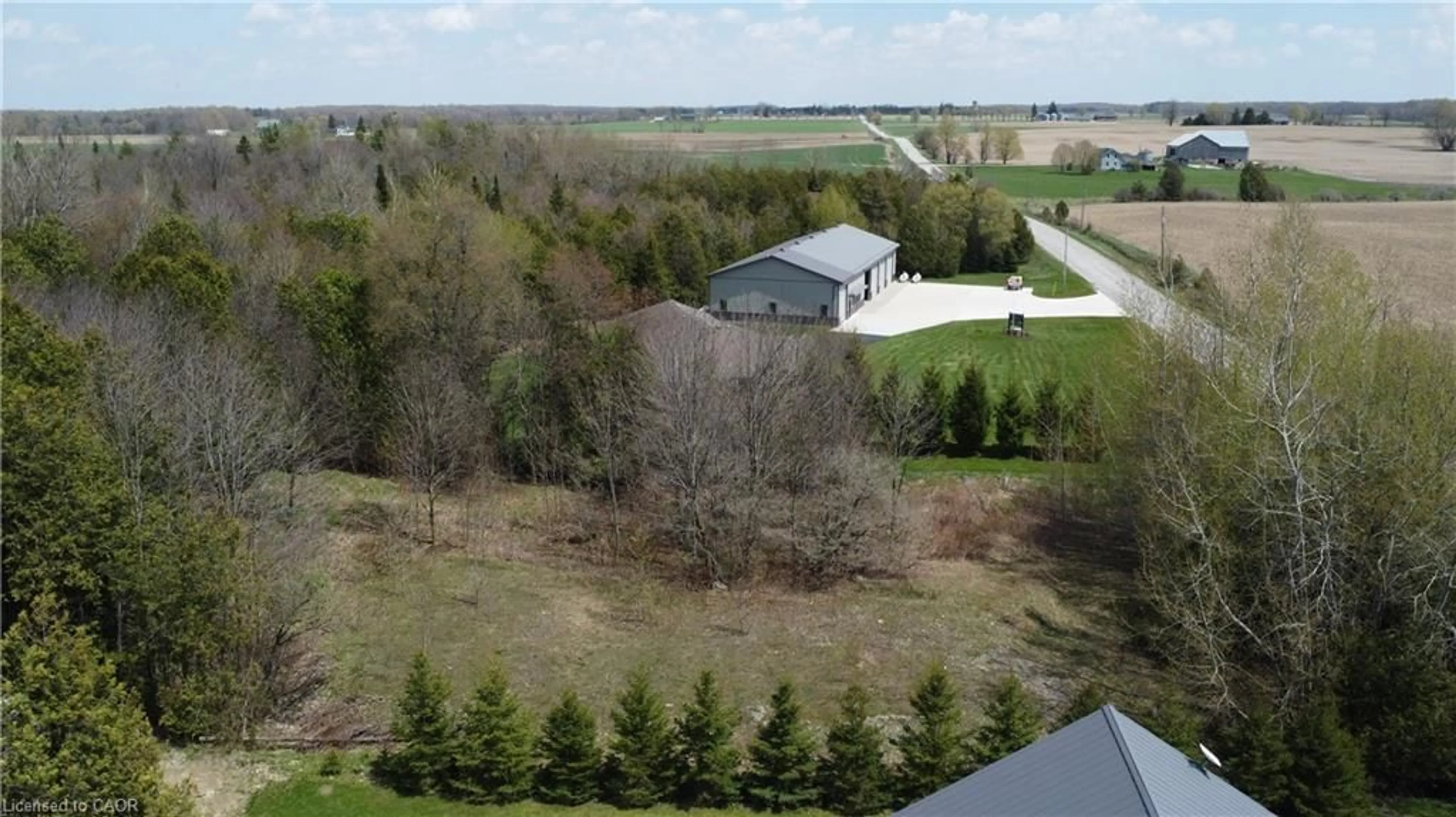 A pic from outside/outdoor area/front of a property/back of a property/a pic from drone, water/lake/river/ocean view for 5618 5th Line, Palmerston Ontario N0G 2P0