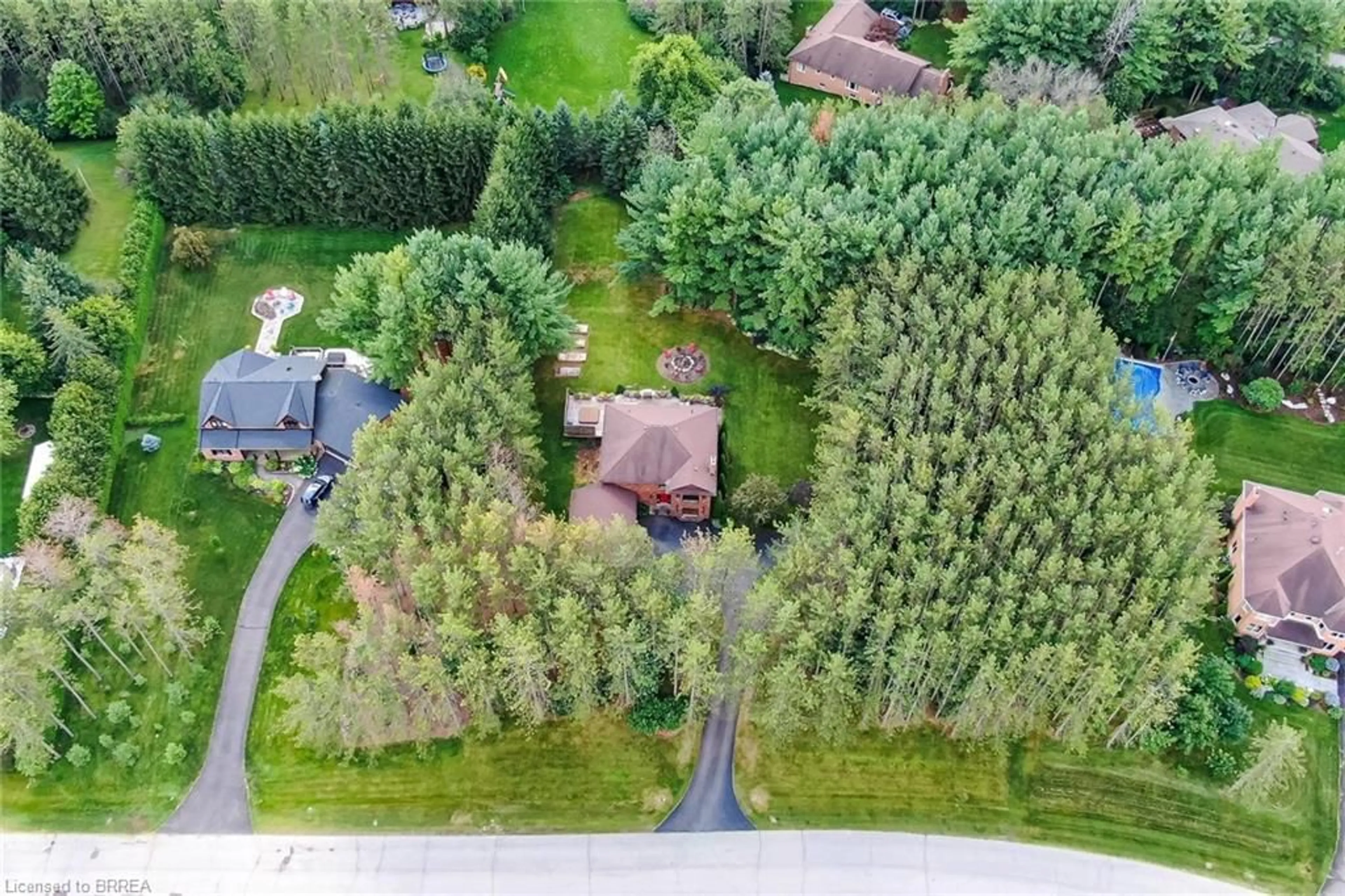 A pic from outside/outdoor area/front of a property/back of a property/a pic from drone, forest/trees view for 4 Pine Ridge Rd, Wellington Ontario N0B 1T0