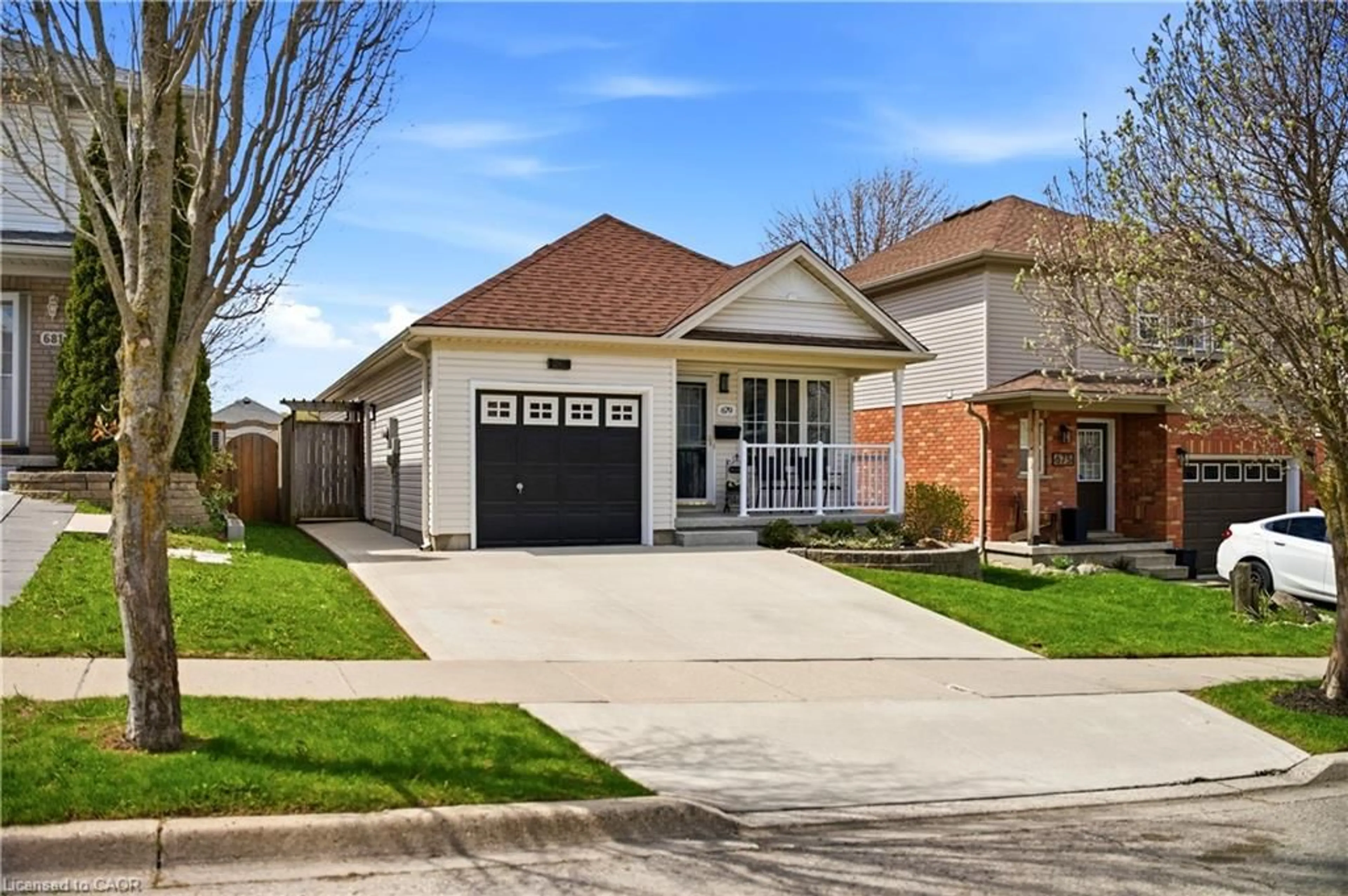 Home with brick exterior material, street for 679 Zermatt Dr, Waterloo Ontario N2T 2V2