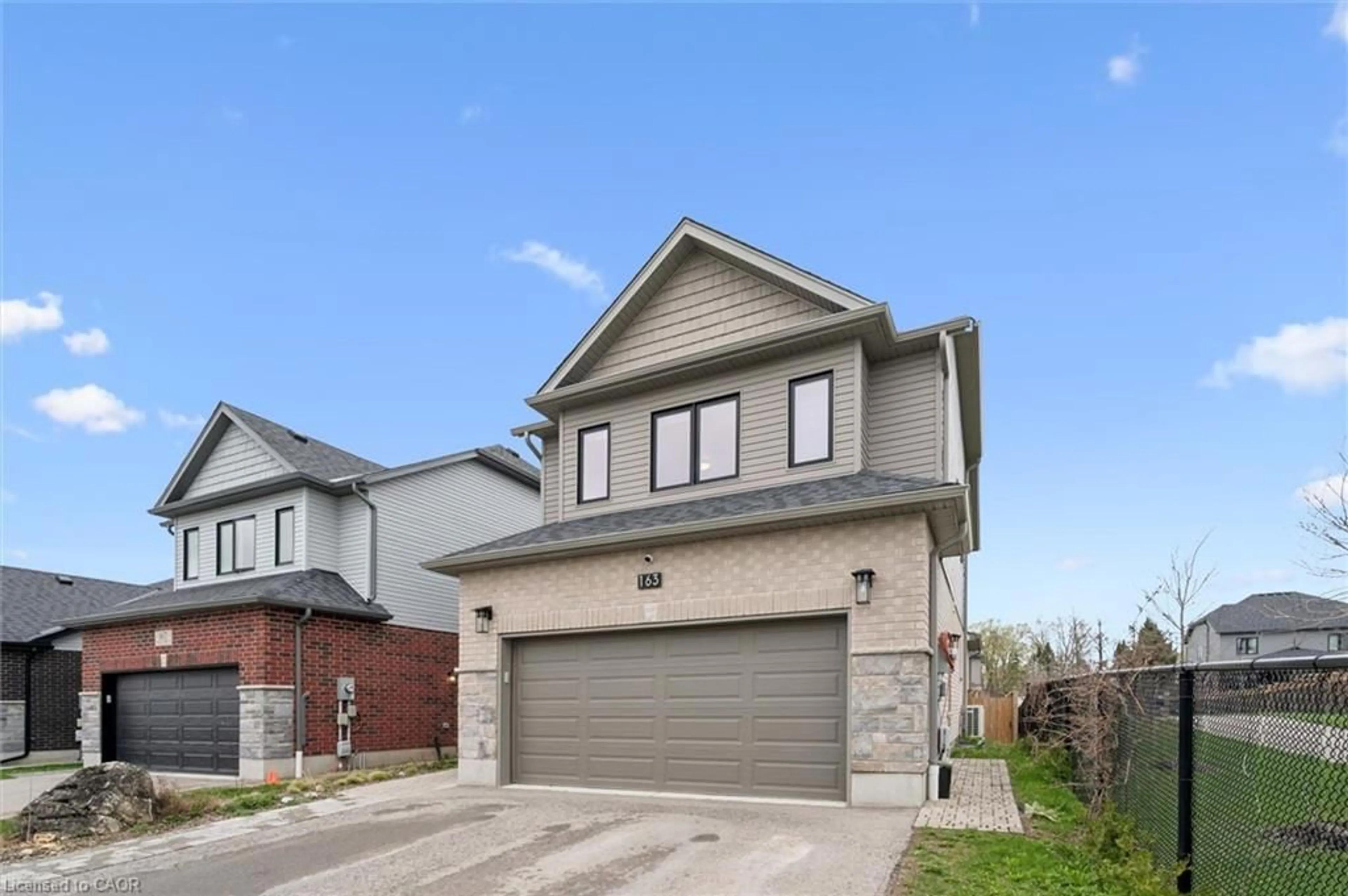 Home with brick exterior material, street for 163 Halls Dr, Elora Ontario N0B 1S0