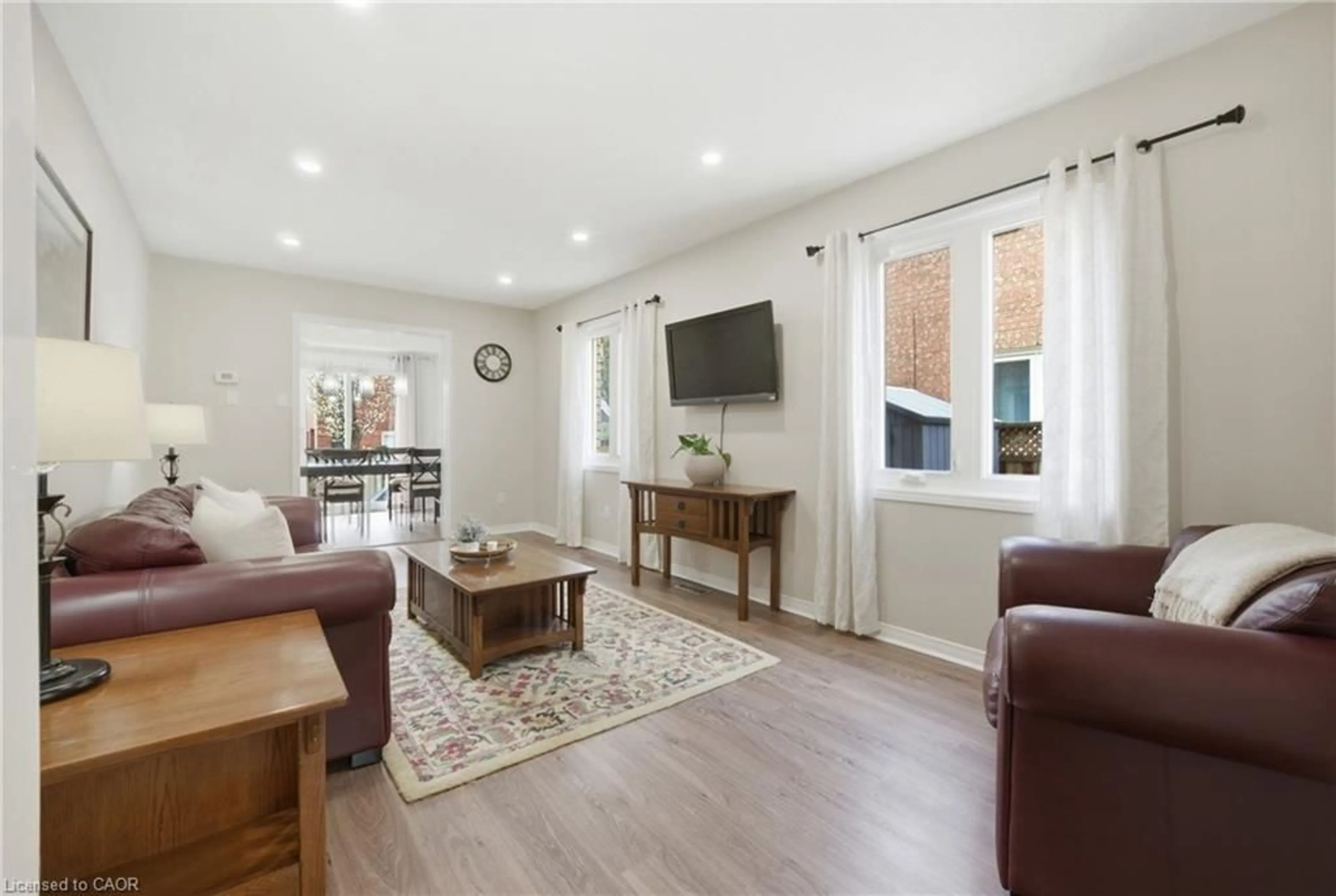 Living room with furniture, wood/laminate floor for 51 Harnesworth Cres, Hamilton Ontario L8B 0J3