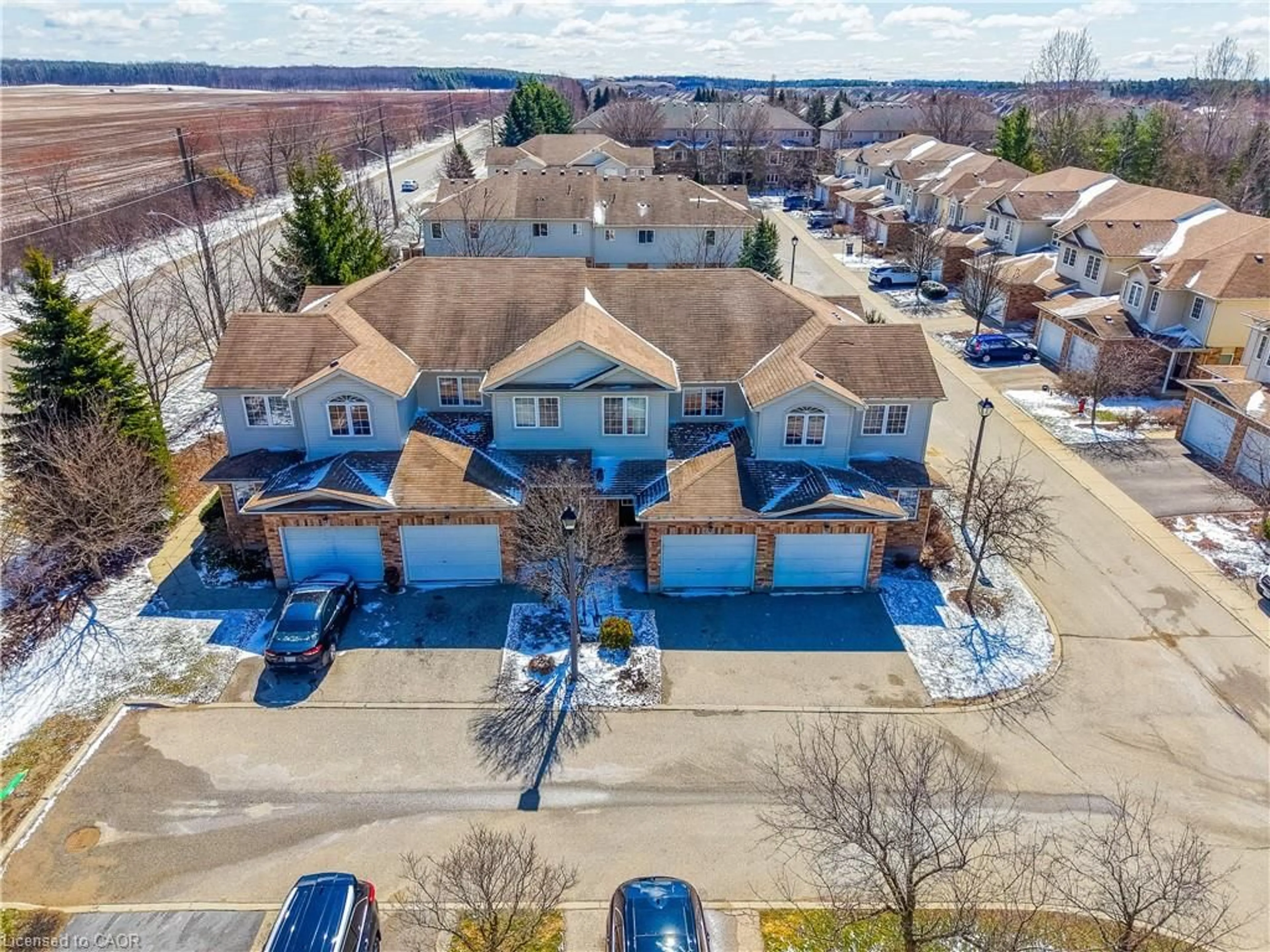 A pic from outside/outdoor area/front of a property/back of a property/a pic from drone, street for 105 Bard Blvd #40, Guelph Ontario N1L 0E2