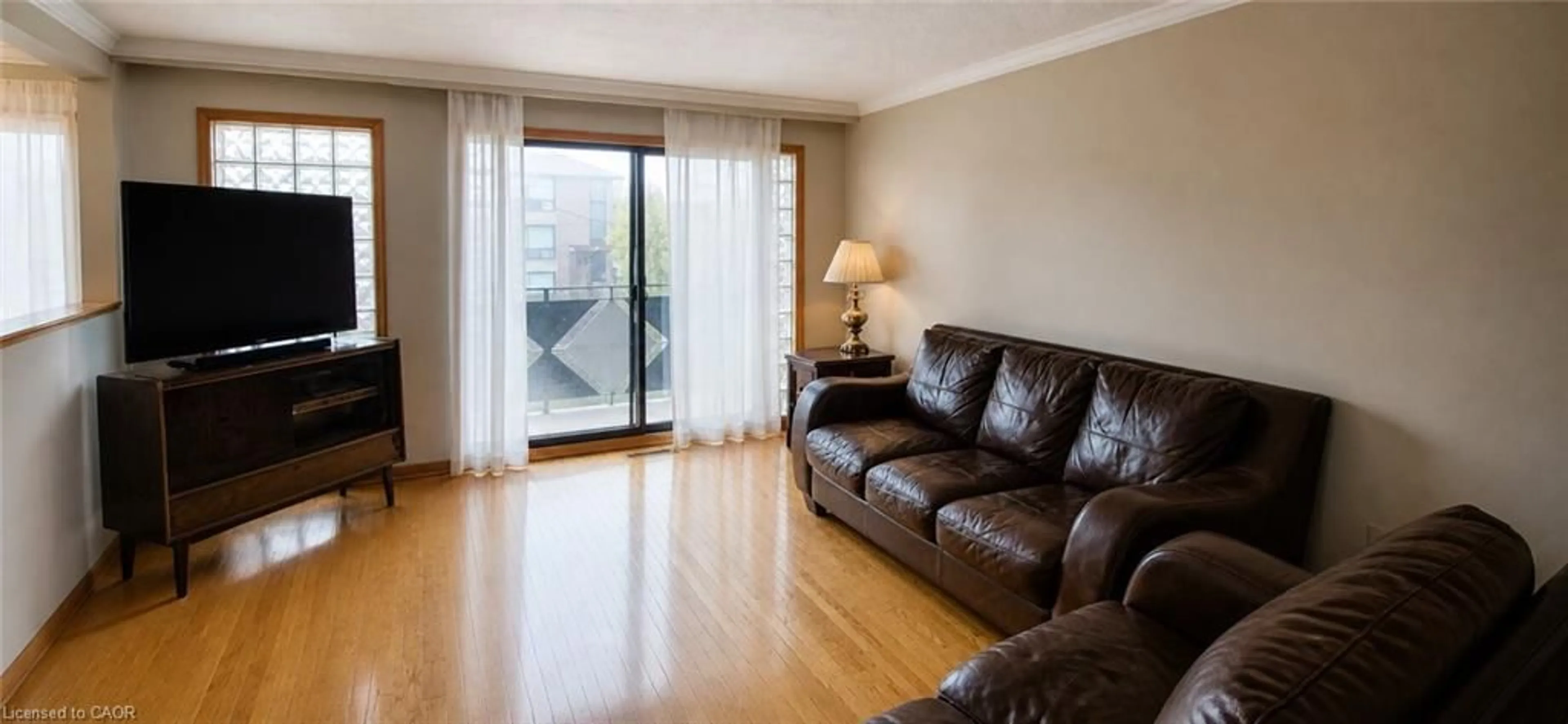 Living room with furniture, wood/laminate floor for 4 Imogene Ave, North York Ontario M9M 1N6