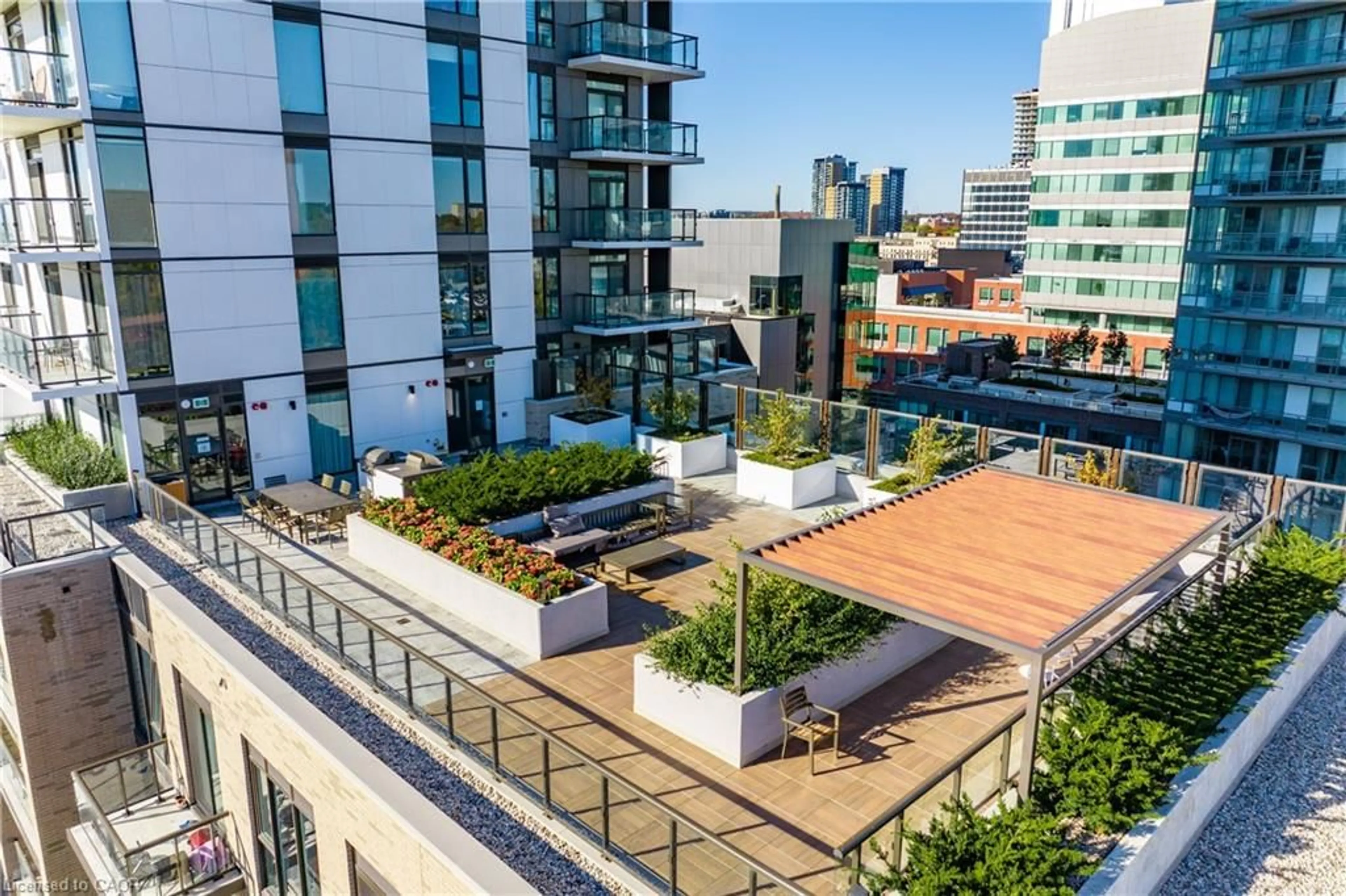 Patio, city buildings view from balcony for 55 Duke St #322, Kitchener Ontario N2H 0C9