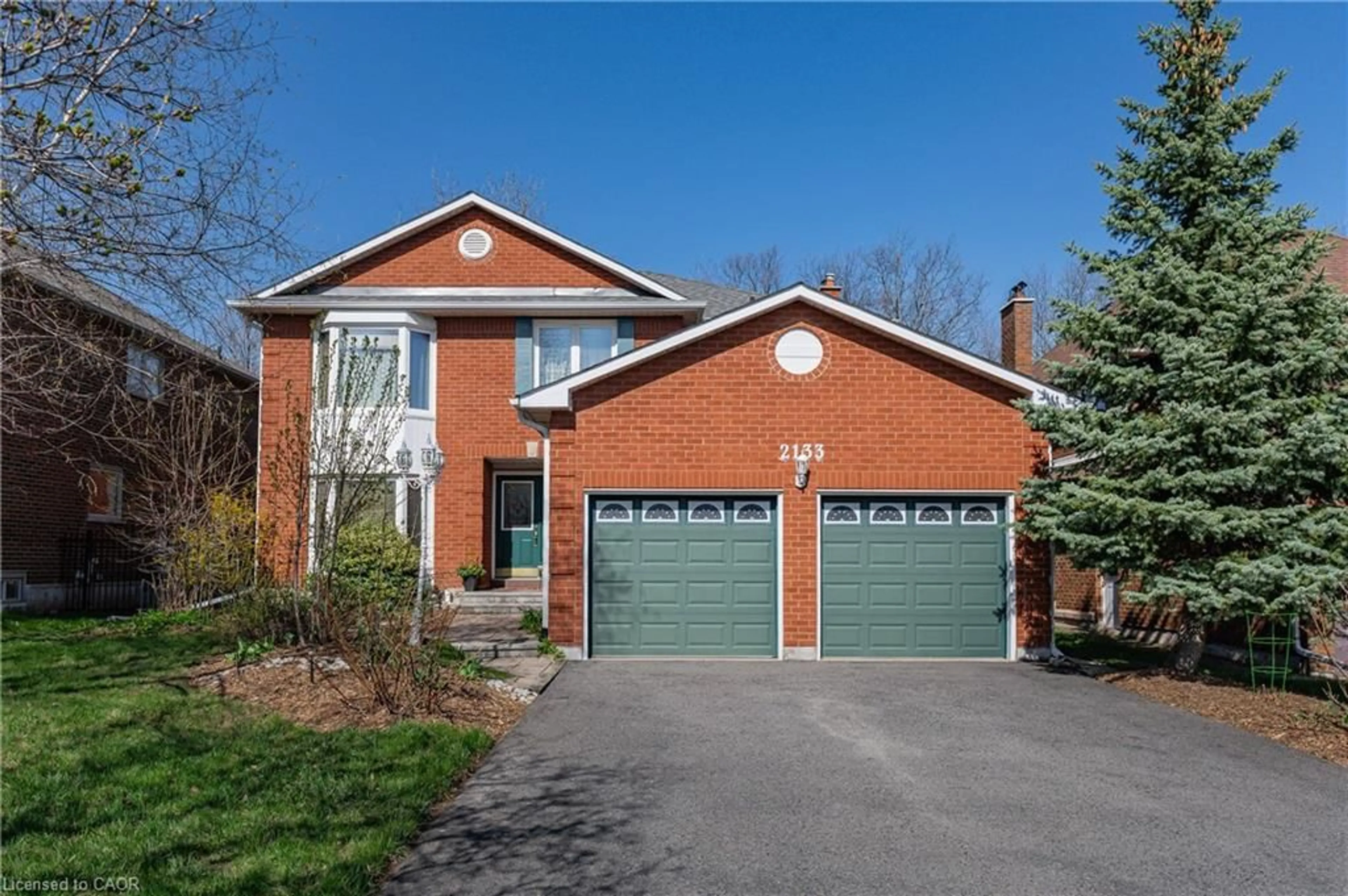 Home with brick exterior material, street for 2133 Grand Blvd, Oakville Ontario L6H 5M3