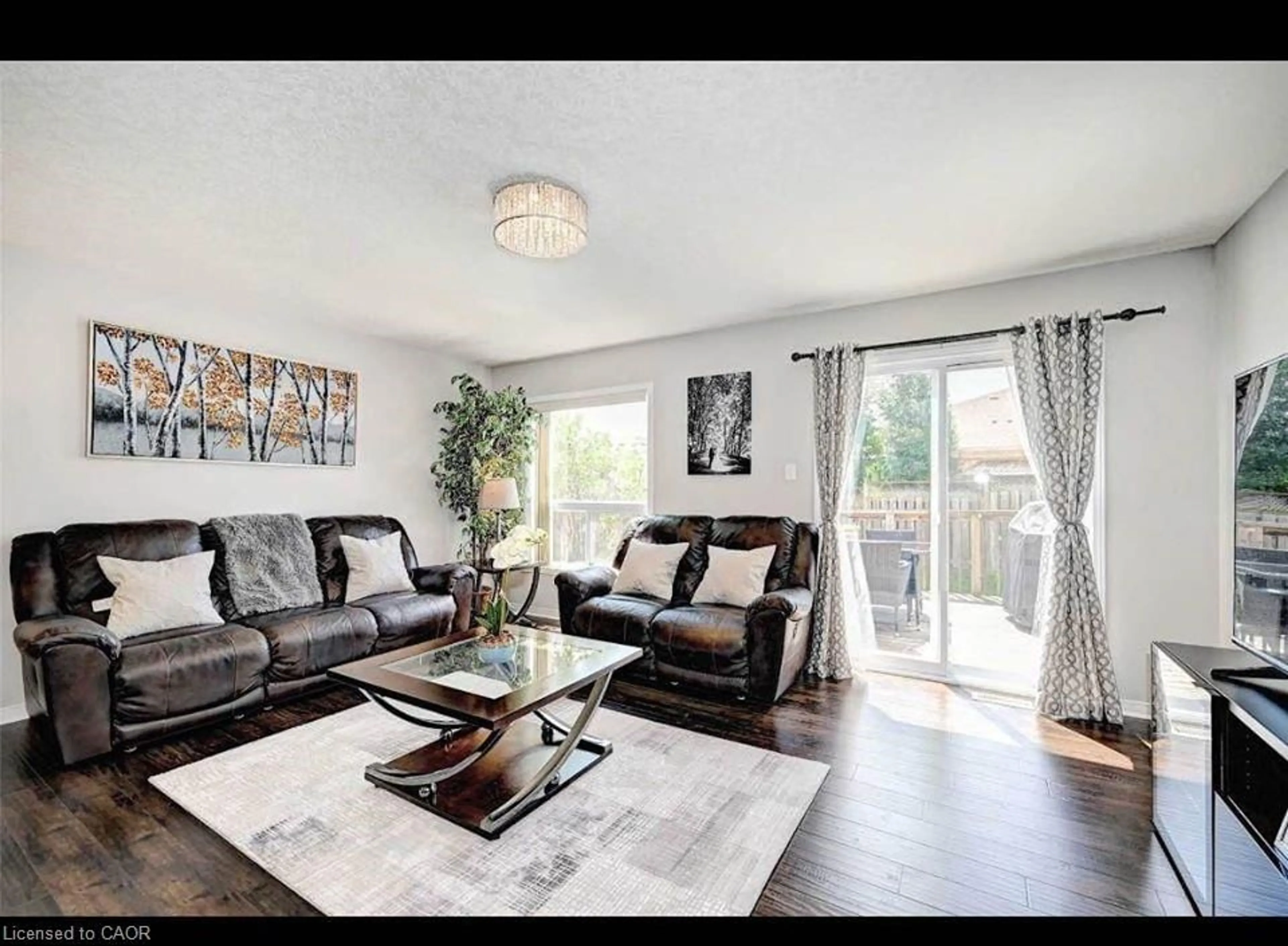 Living room with furniture, wood/laminate floor for 130 Upper Mercer St, Kitchener Ontario N2A 4N2
