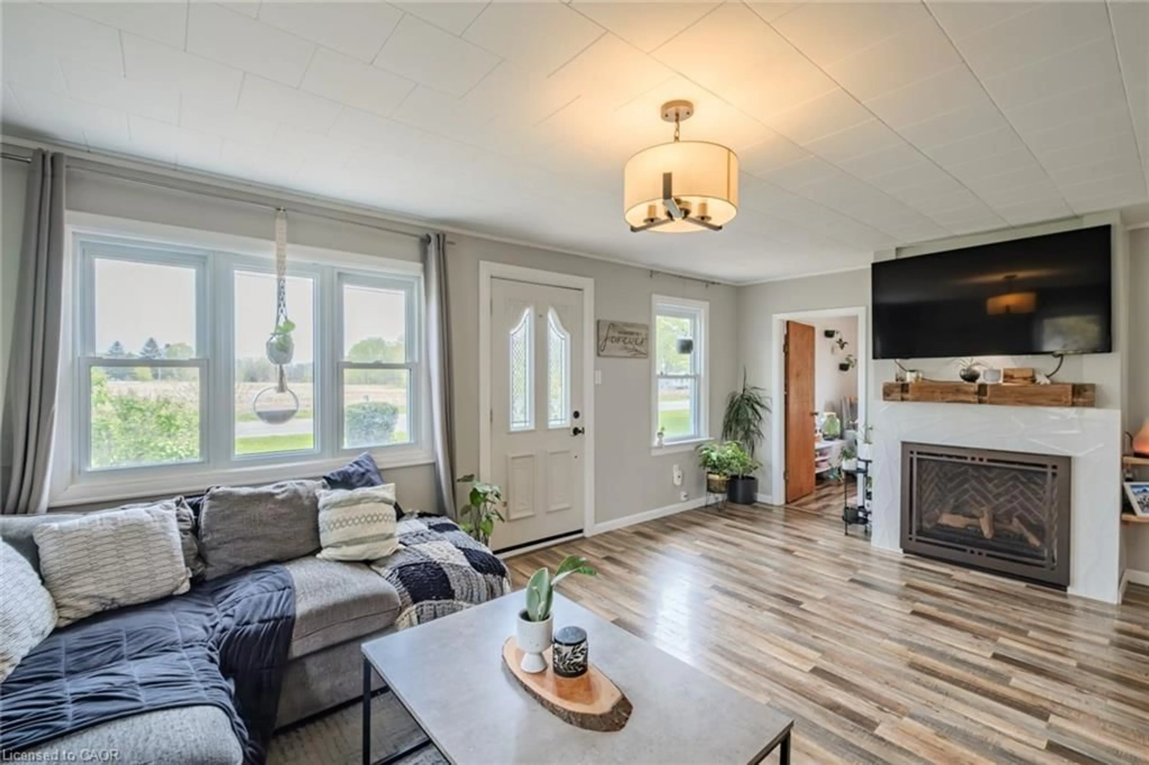 Living room with furniture, wood/laminate floor for 125 Townline St, St. Williams Ontario N0E 1P0