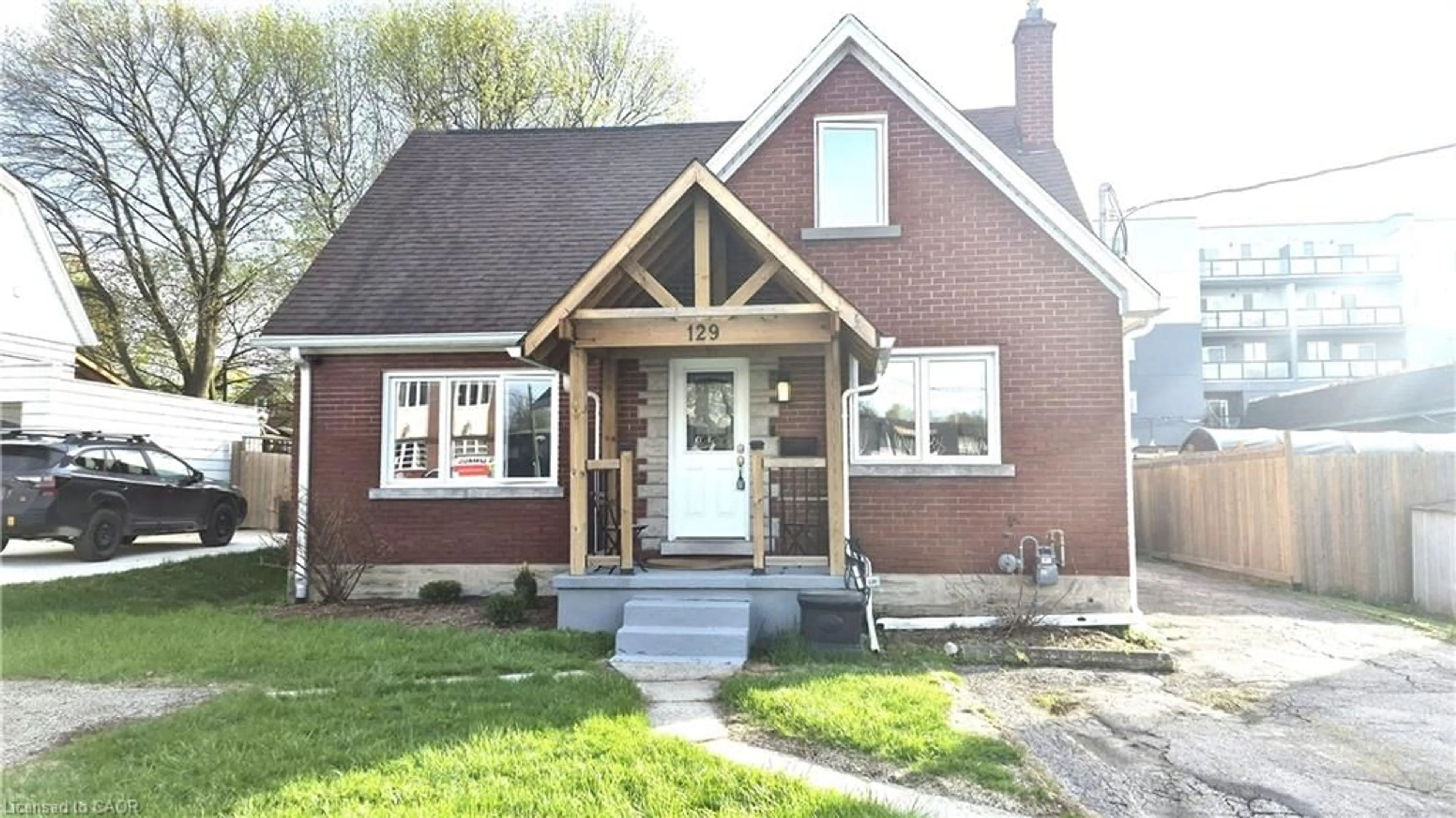Home with brick exterior material, street for 129 Moore Ave, Waterloo Ontario N2J 1X4