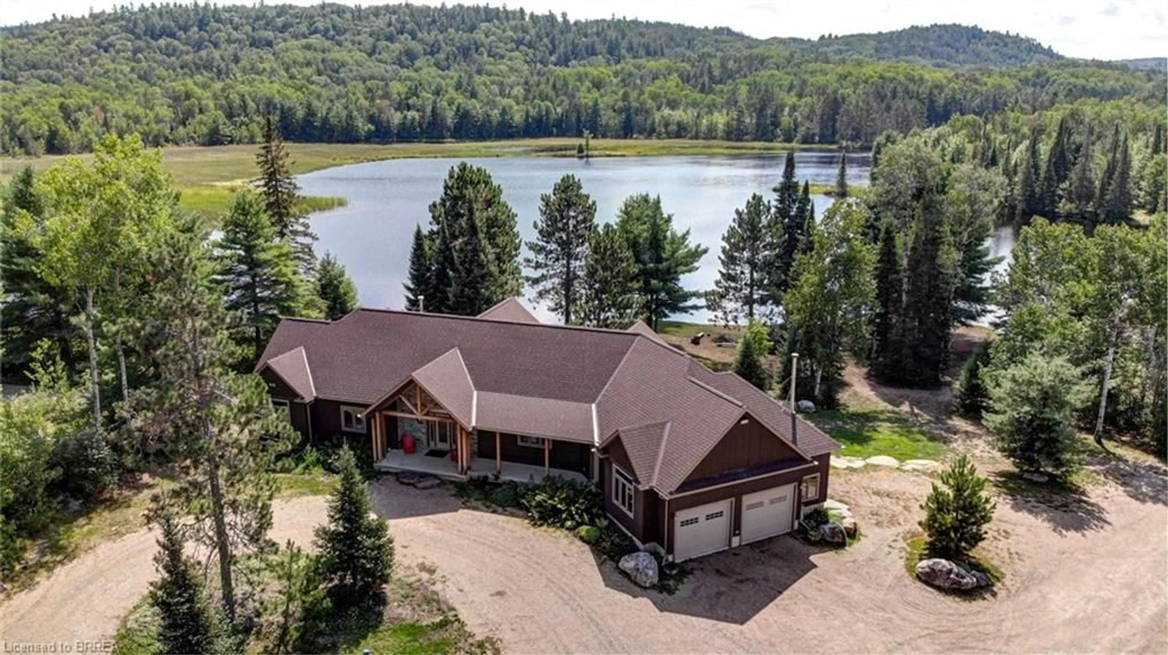 A pic from outside/outdoor area/front of a property/back of a property/a pic from drone, water/lake/river/ocean view for 6605 #523 Hwy, Madawaska Ontario K0J 2C0