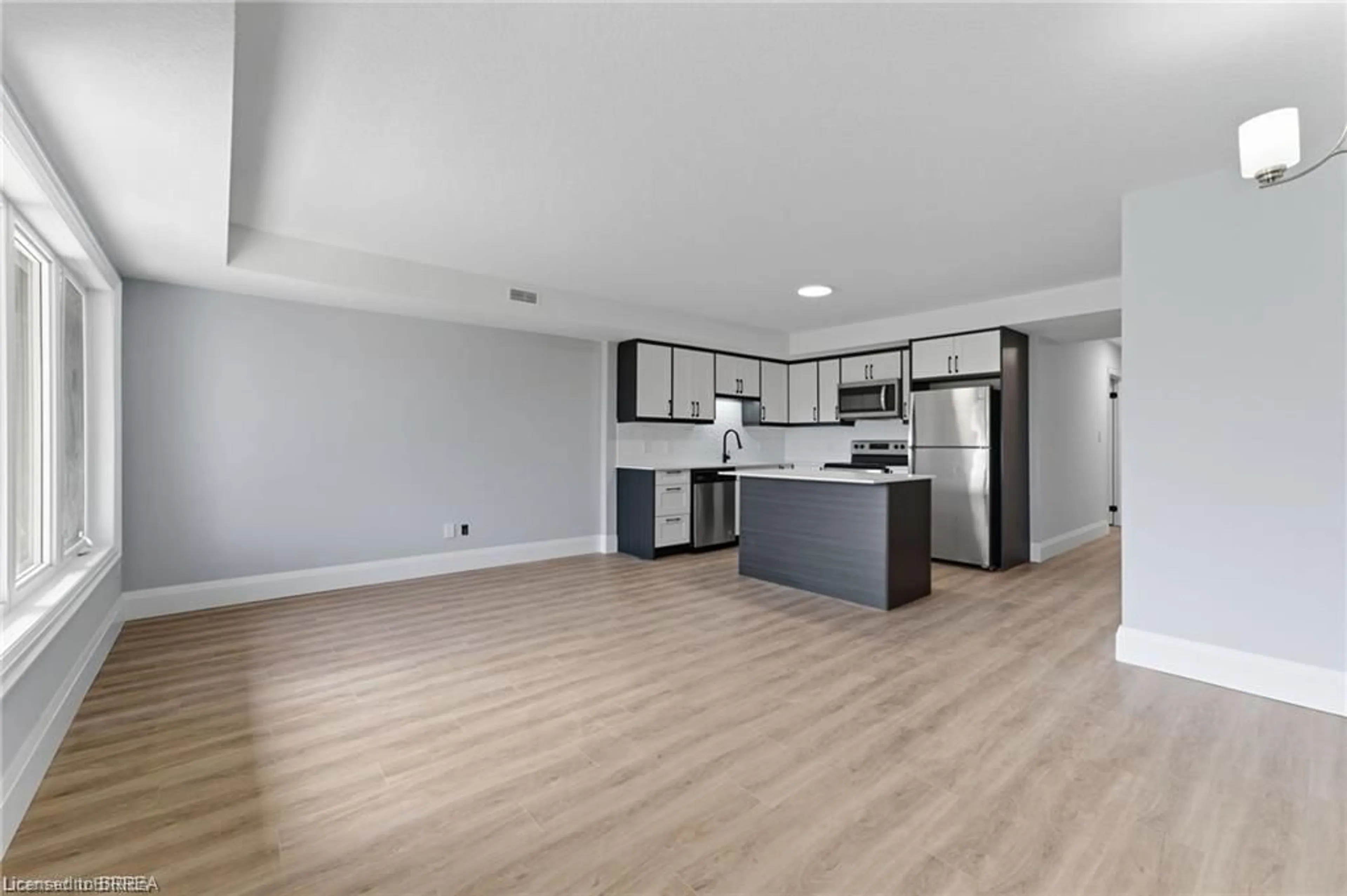 Open concept kitchen, wood/laminate floor for 160 Rochefort St #A17, Kitchener Ontario N2R 0P5
