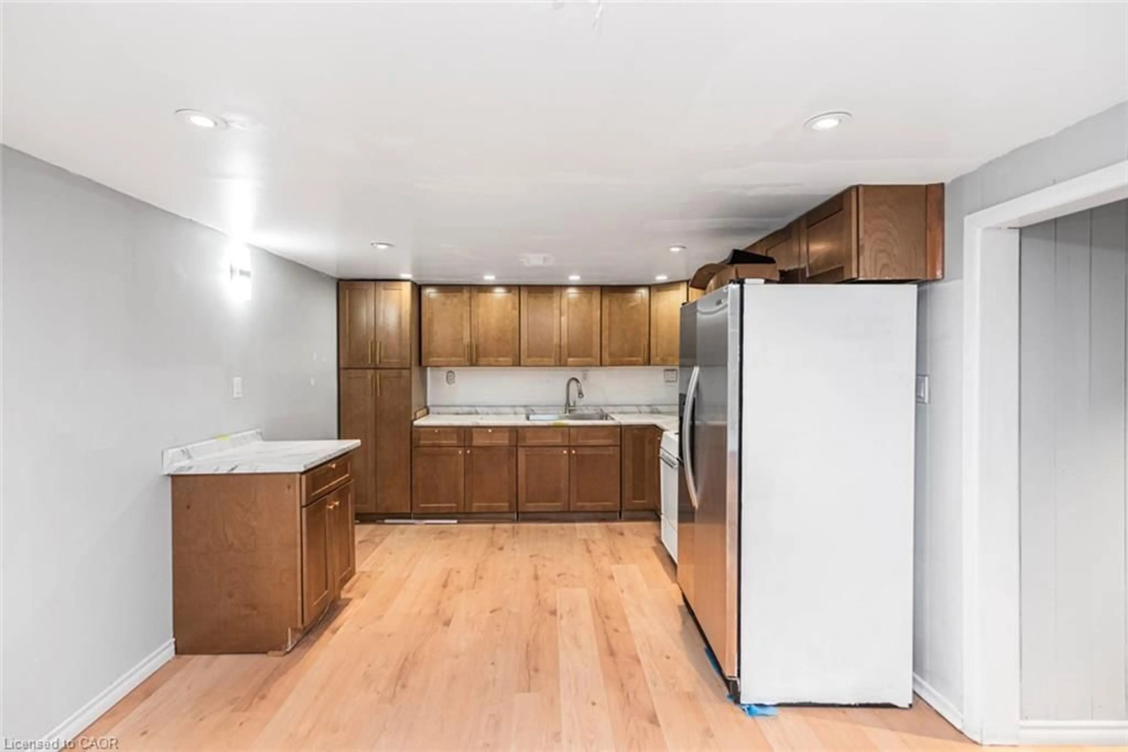 Open concept kitchen, wood/laminate floor for 112 Nash Rd, Hamilton Ontario L8K 4J7