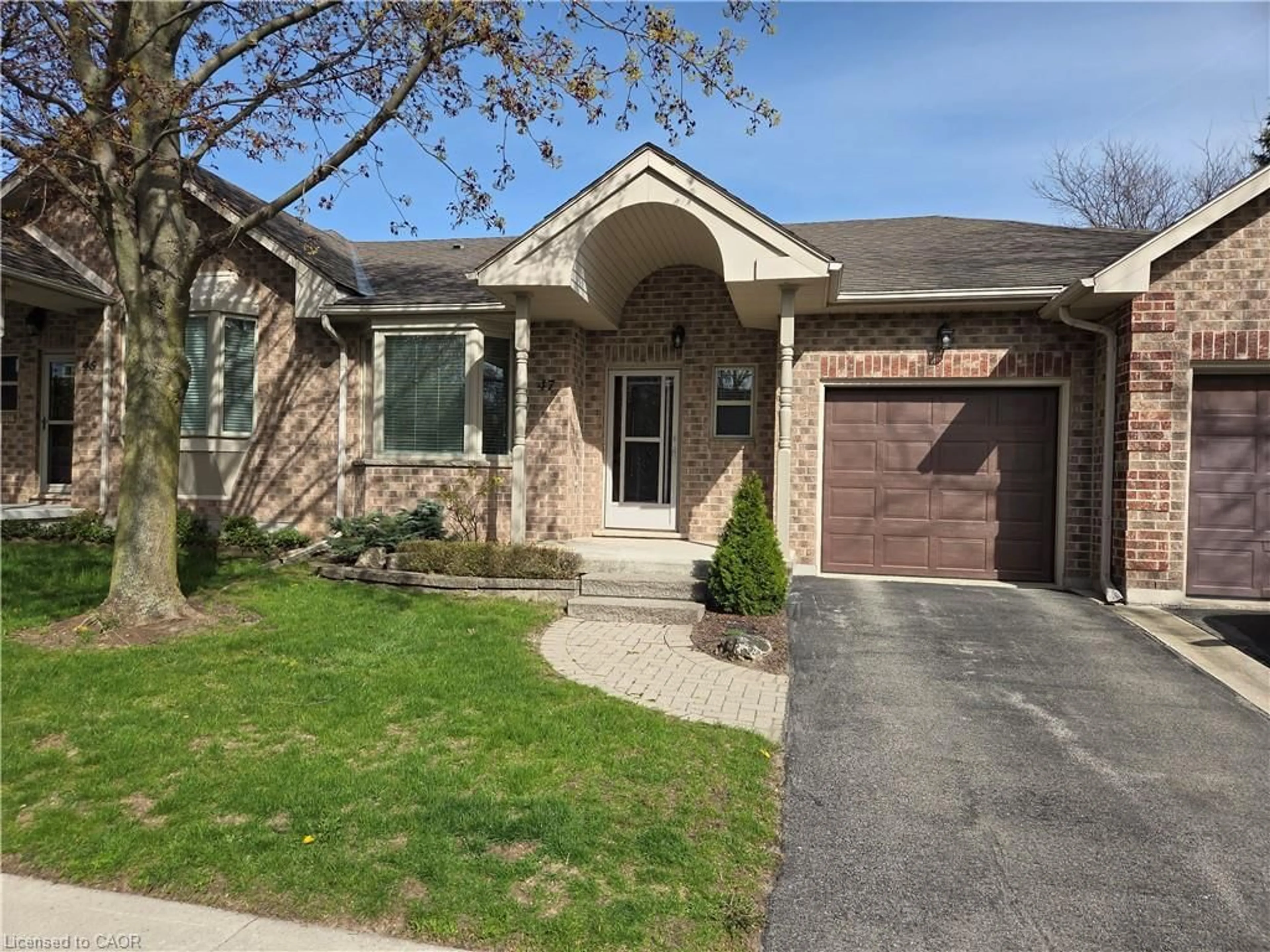 Home with brick exterior material, street for 47 Greentrail Dr, Mount Hope Ontario L0R 1W0