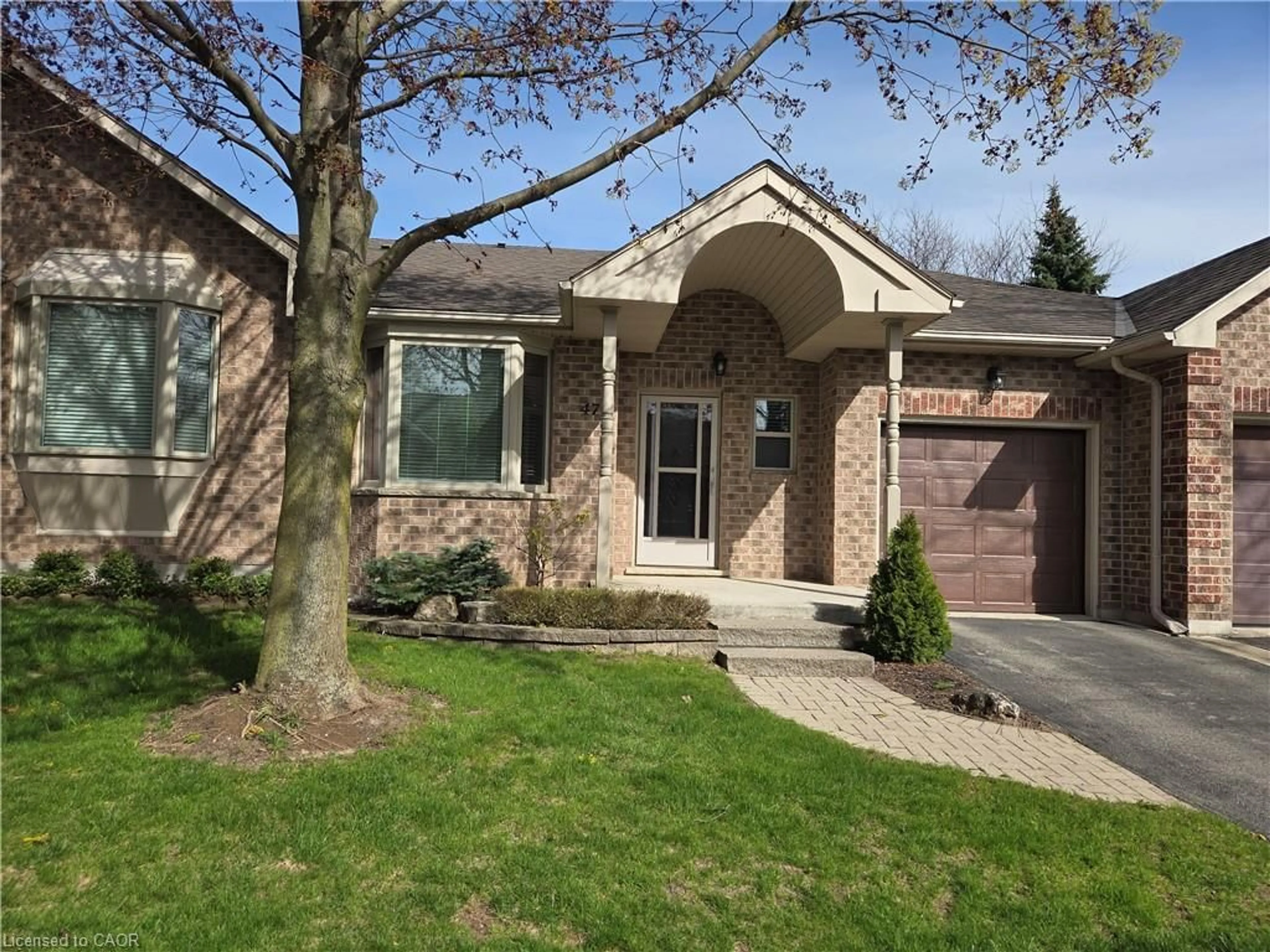 Home with brick exterior material, street for 47 Greentrail Dr, Mount Hope Ontario L0R 1W0