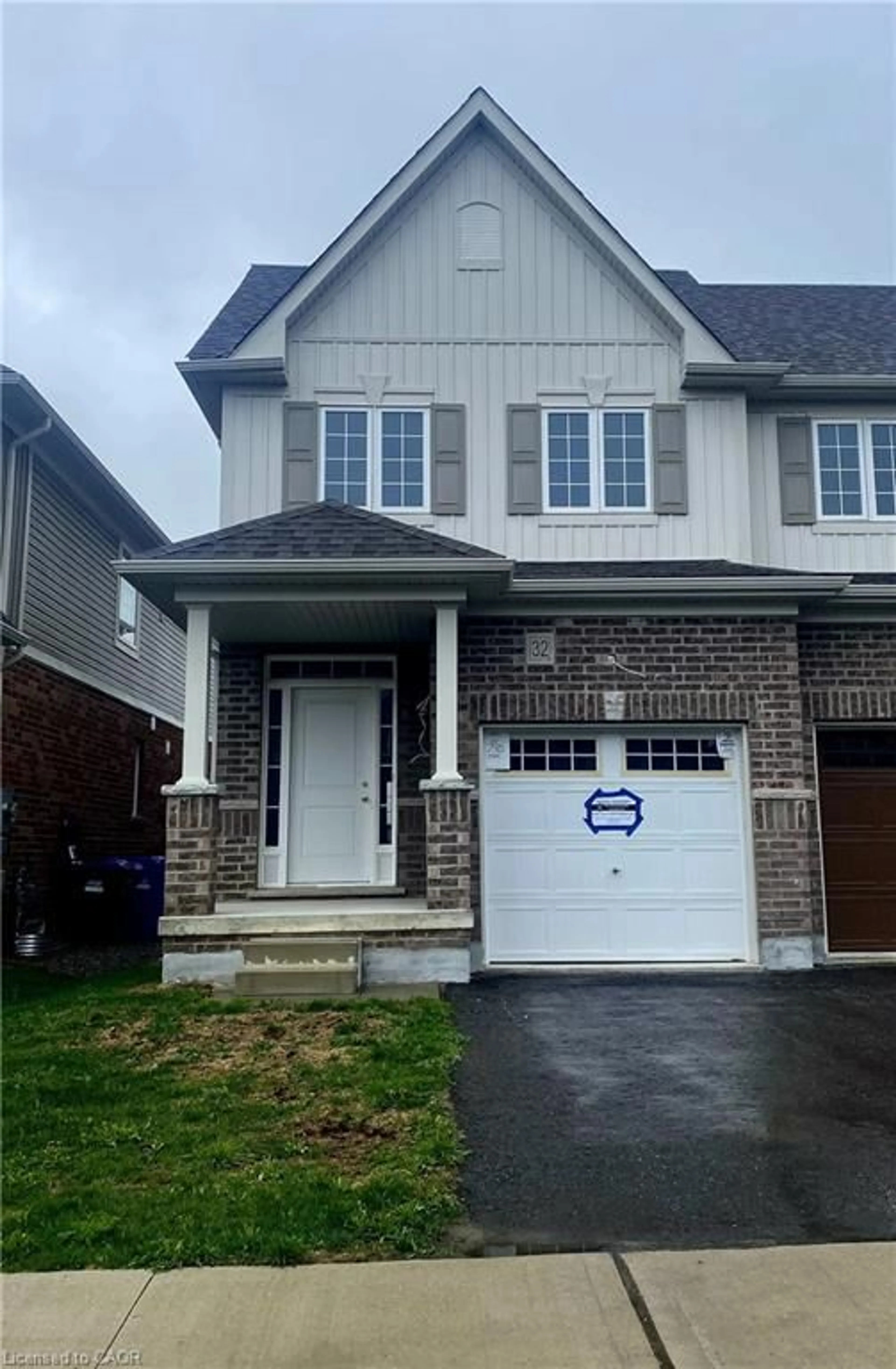 Home with brick exterior material, street for 32 Elsegood Dr, Guelph Ontario N1L 1B3