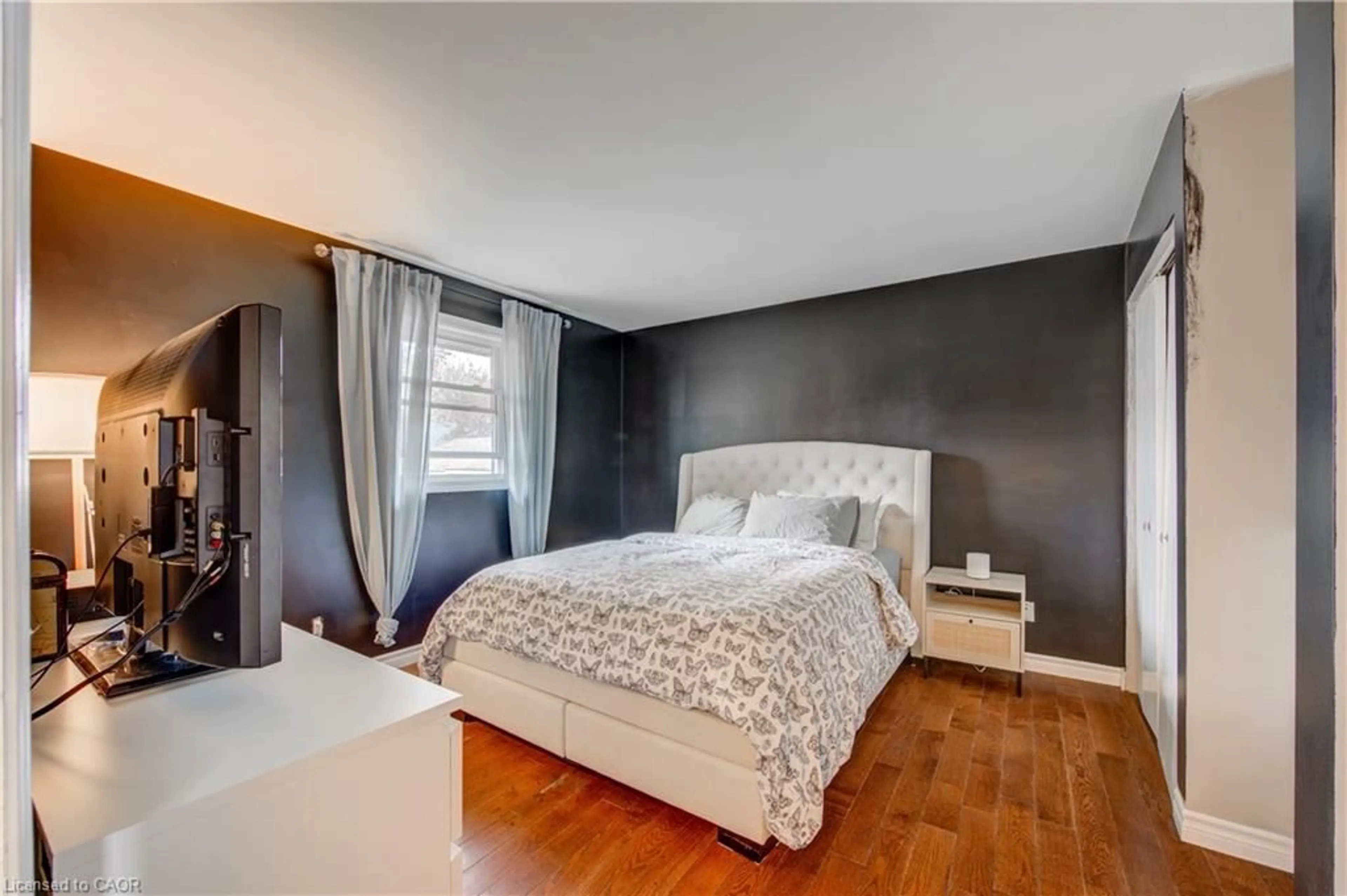 Bedroom with bed, wood/laminate floor for 222 Caverly Rd, Aylmer Ontario N5H 2P7