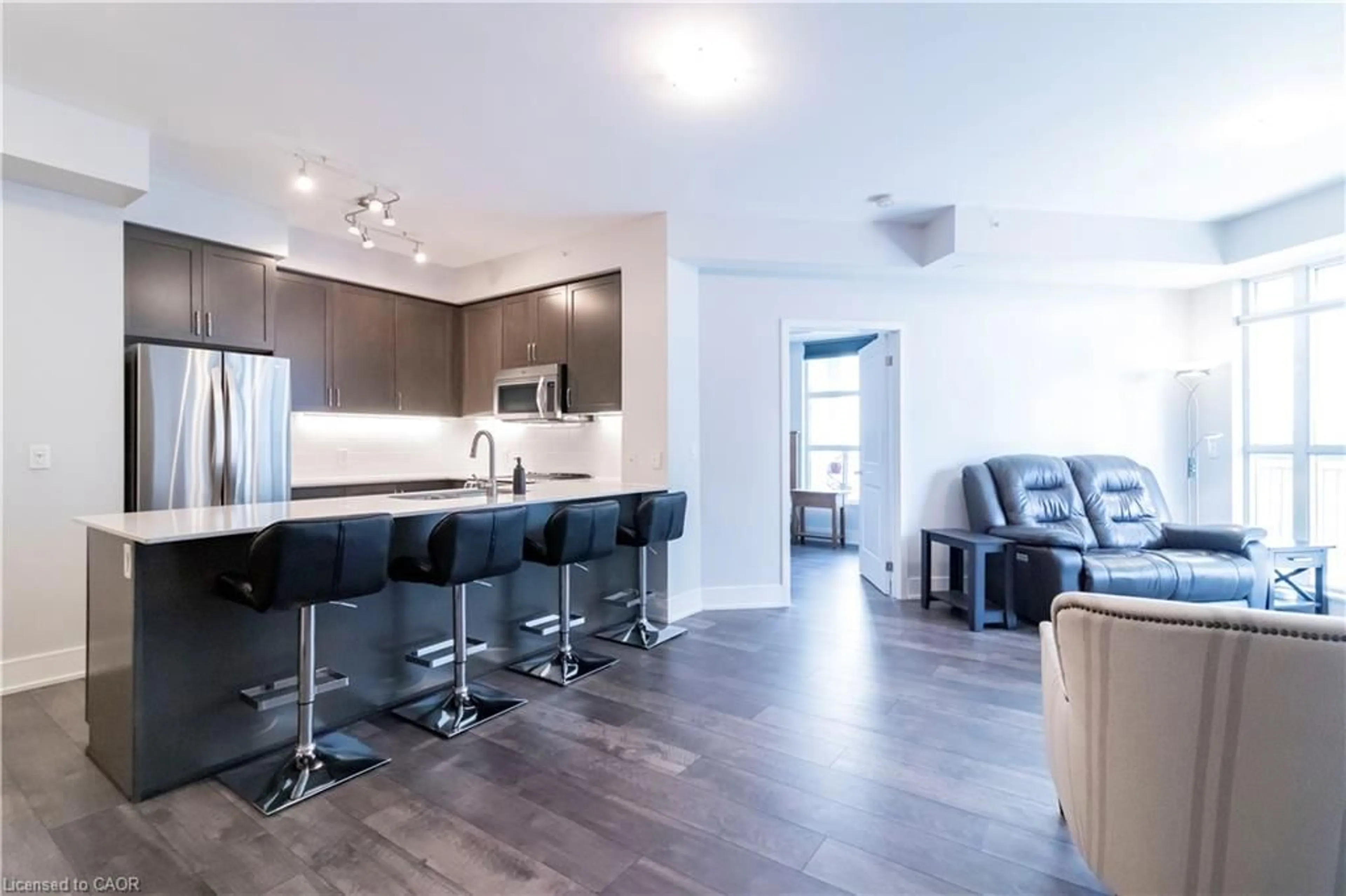 Open concept kitchen, wood/laminate floor for 144 Park St #1310, Waterloo Ontario N2L 0B6