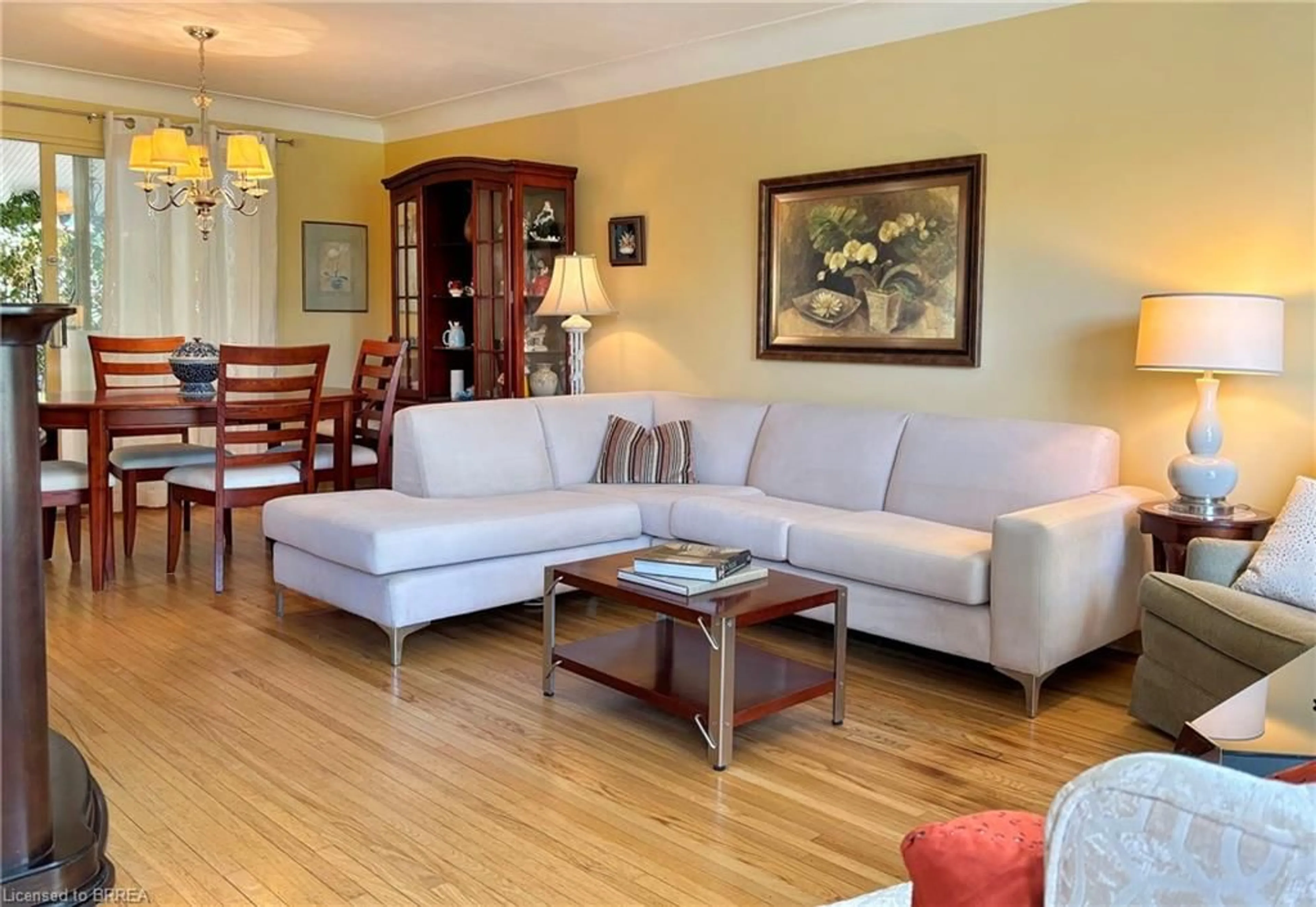 Living room with furniture, wood/laminate floor for 38 Slater St, Brantford Ontario N3T 4N9